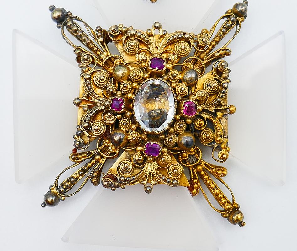 Amazing Victorian Maltese cross pendant created in the 1900s. 
The pendant is made of 14 karat (tested) yellow gold, and multi-gemstones.
Measurements: 1 ¾” x 1 ¾” (4.3 x 4.3 centimeters) without the bail.  
Weight; 23.8 grams.
Unique and different,