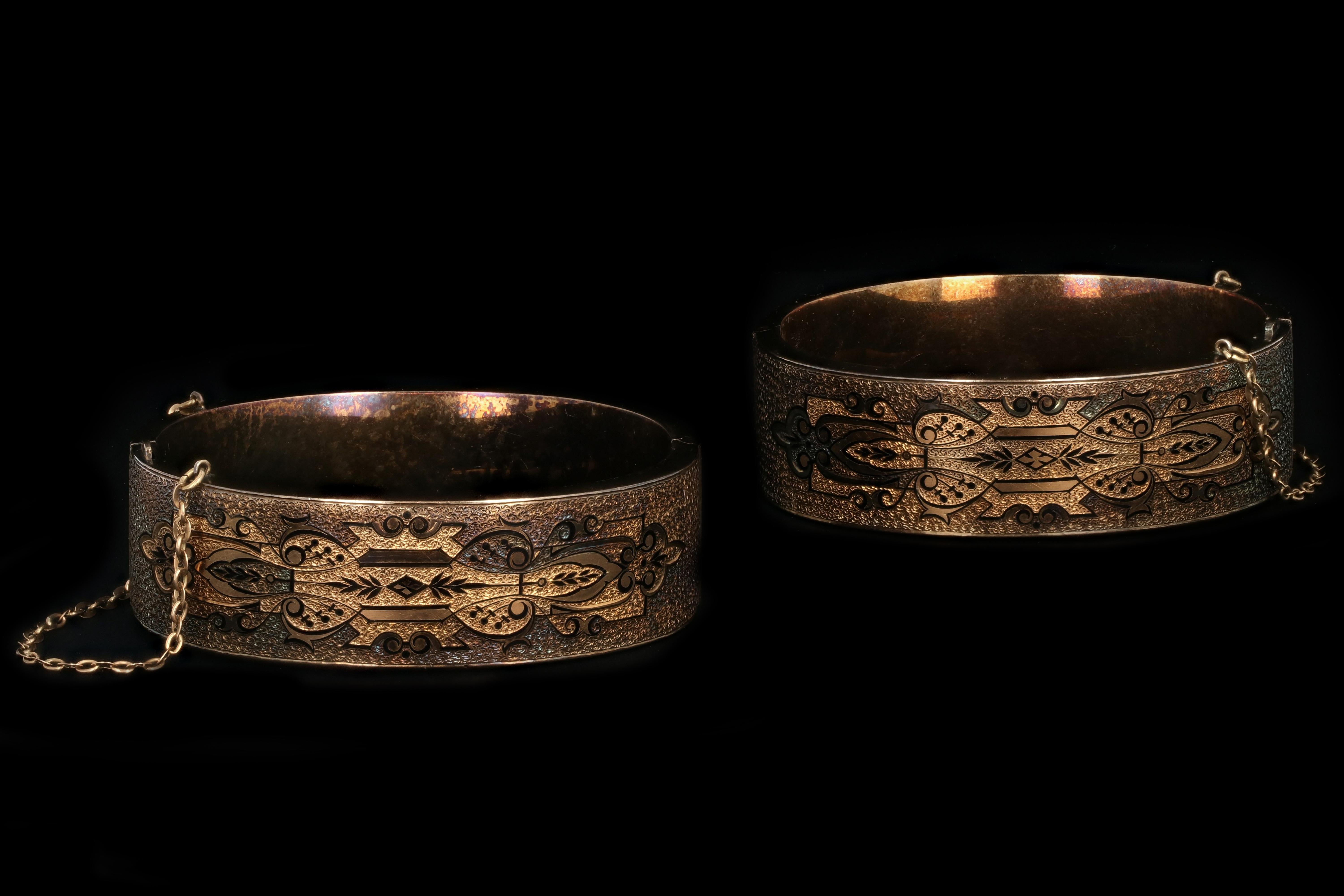 A lovely pair of Victorian wedding bracelets crafted in 14k yellow gold and etched black taille d’apargne retail. Comes with original box.

Era: Victorian

Hallmarks: 