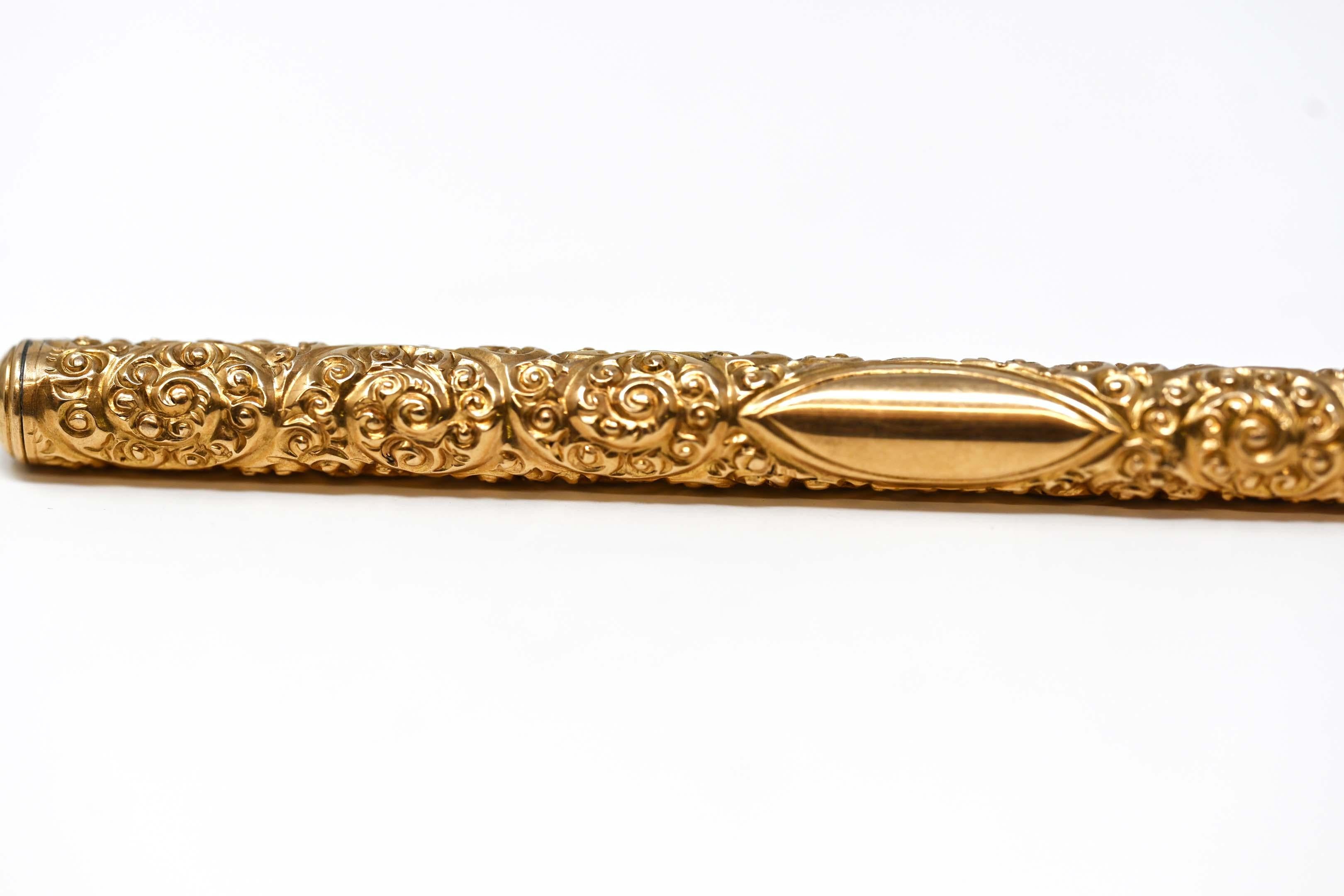Victorian 14k yellow gold pen with elaborate chiselled work No monogram, stamped 14k, metal mechanism for refill. No maker mark, 5 1/8 inches long, in excellent condition. Missing a refill.