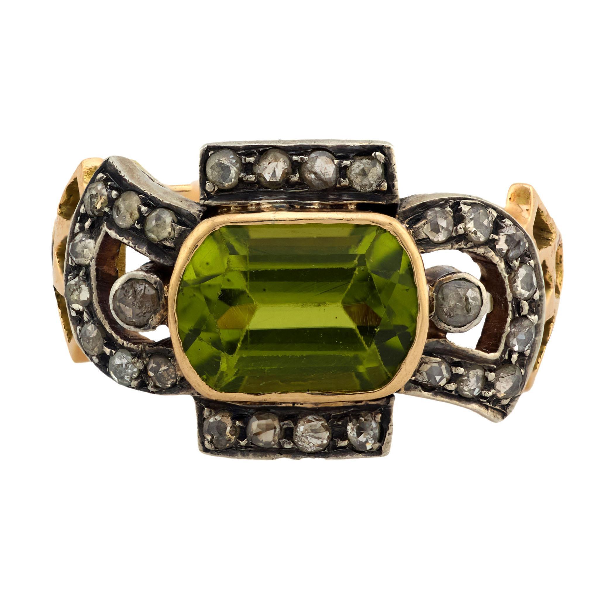 An incredible gemstone ring from the Victorian (ca1880s) era! Crafted in 14k yellow gold and platinum, this breathtaking ring features a central cushion cut 2.25ct peridot. The stone is held within a bezel setting, and displays an incredibly vivid