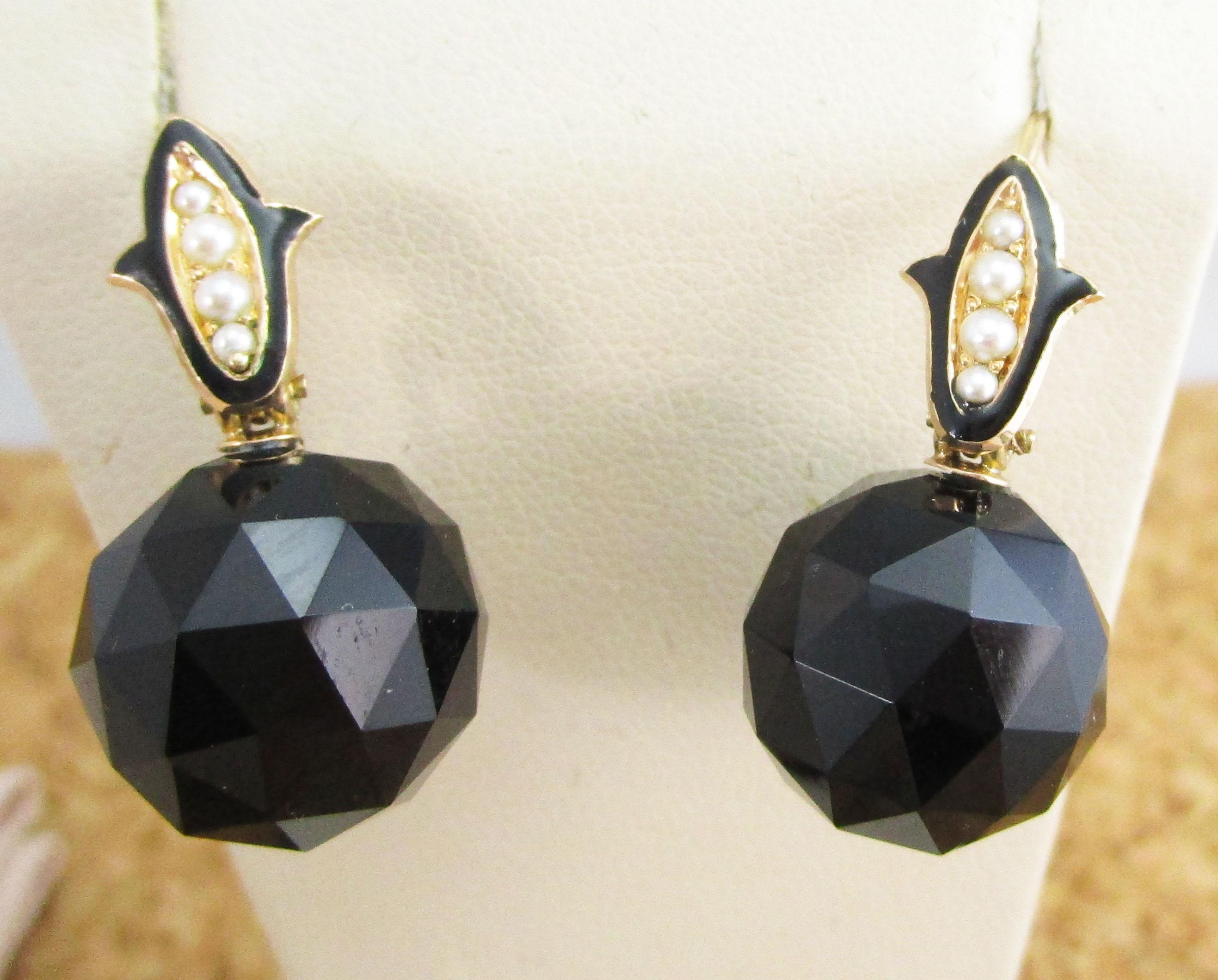 This is a gorgeous pair of Victorian earrings in14k rose gold with dramatic faceted black onyx dangles and deep black onyxaccented by graduated seed pearls. These earrings are unlike any modern jewelry! They are overflowing with the unique appeal of