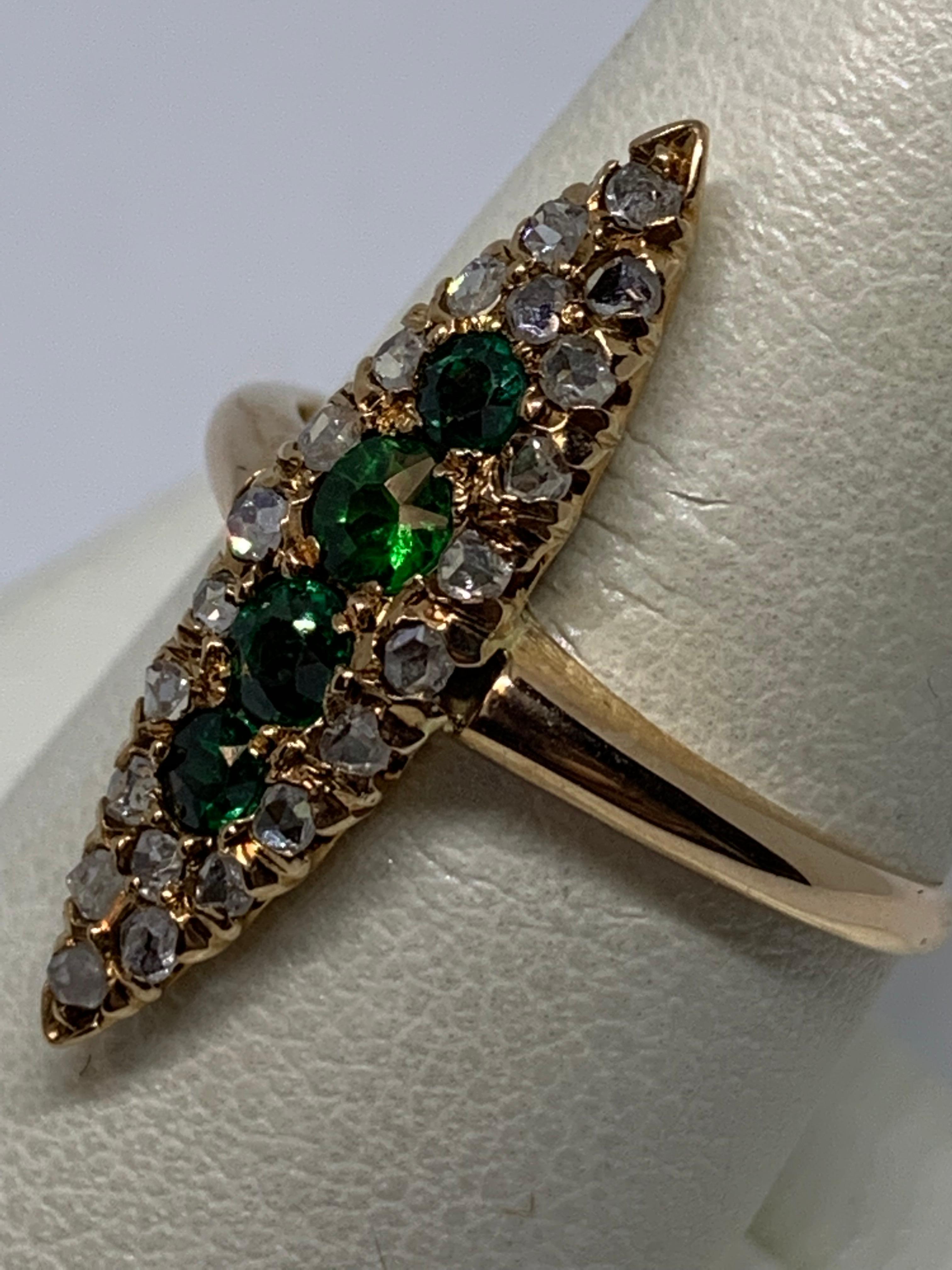 Beautiful Victorian fashion ring in 14kt rose gold with 4 - 2.60-3.00mm round green glass and garnet doublets and 22 - randomly faceted diamonds = .30ct total weight, 1.7 dwt.
