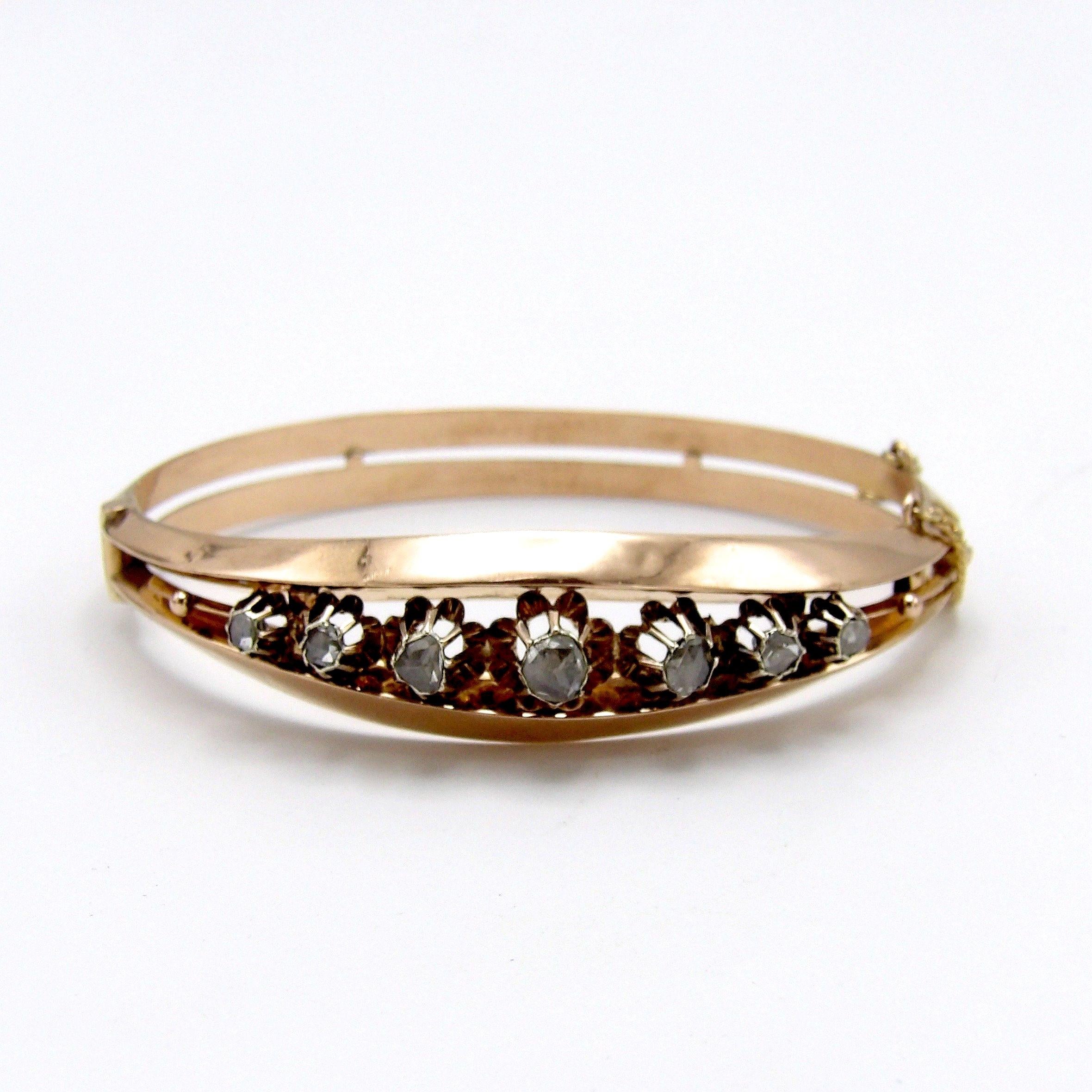 A beautiful rose gold and diamond bracelet from the Victorian era. This piece of jewelry features 7 gorgeous rose cut diamonds that are arranged from the center in a descending order. The largest diamond at the center measures 4.9 mm in diameter and