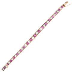 Bracciale vittoriano 14k con linea di rubini e zaffiri