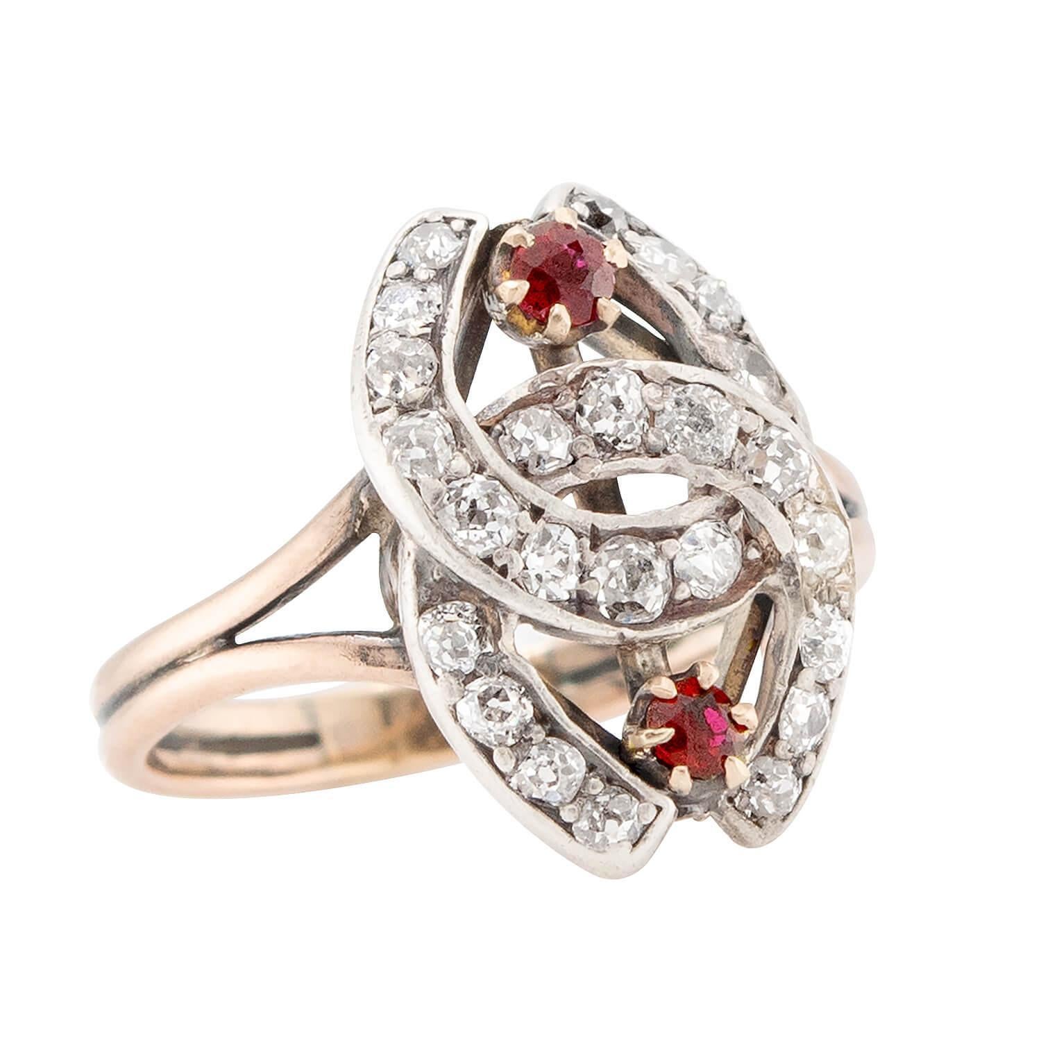 This stylish double horseshoe ring is a fabulous piece from the Victorian (ca1880s) era! A popular style during the Victorian period, this beautiful ring, which is crafted in 14k gold and topped in sterling silver, depicts two interlocking