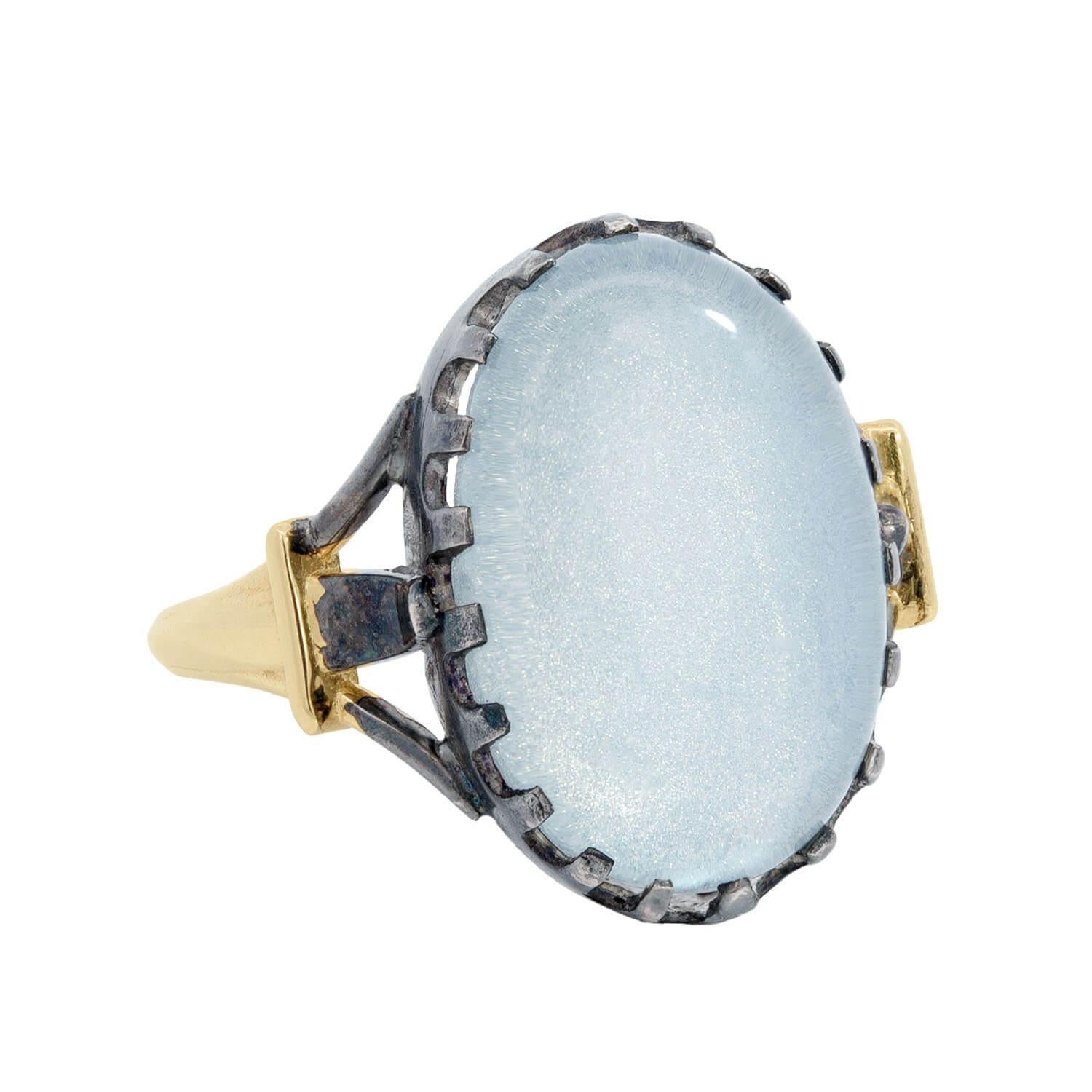 A beautiful moonstone ring from the Victorian (ca1880) era! This lovely ring is made of 14kt yellow gold holds a moonstone cabochon at its center in a sterling silver mounting. The elongated moonstone is oval in shape and has a wonderful pearly