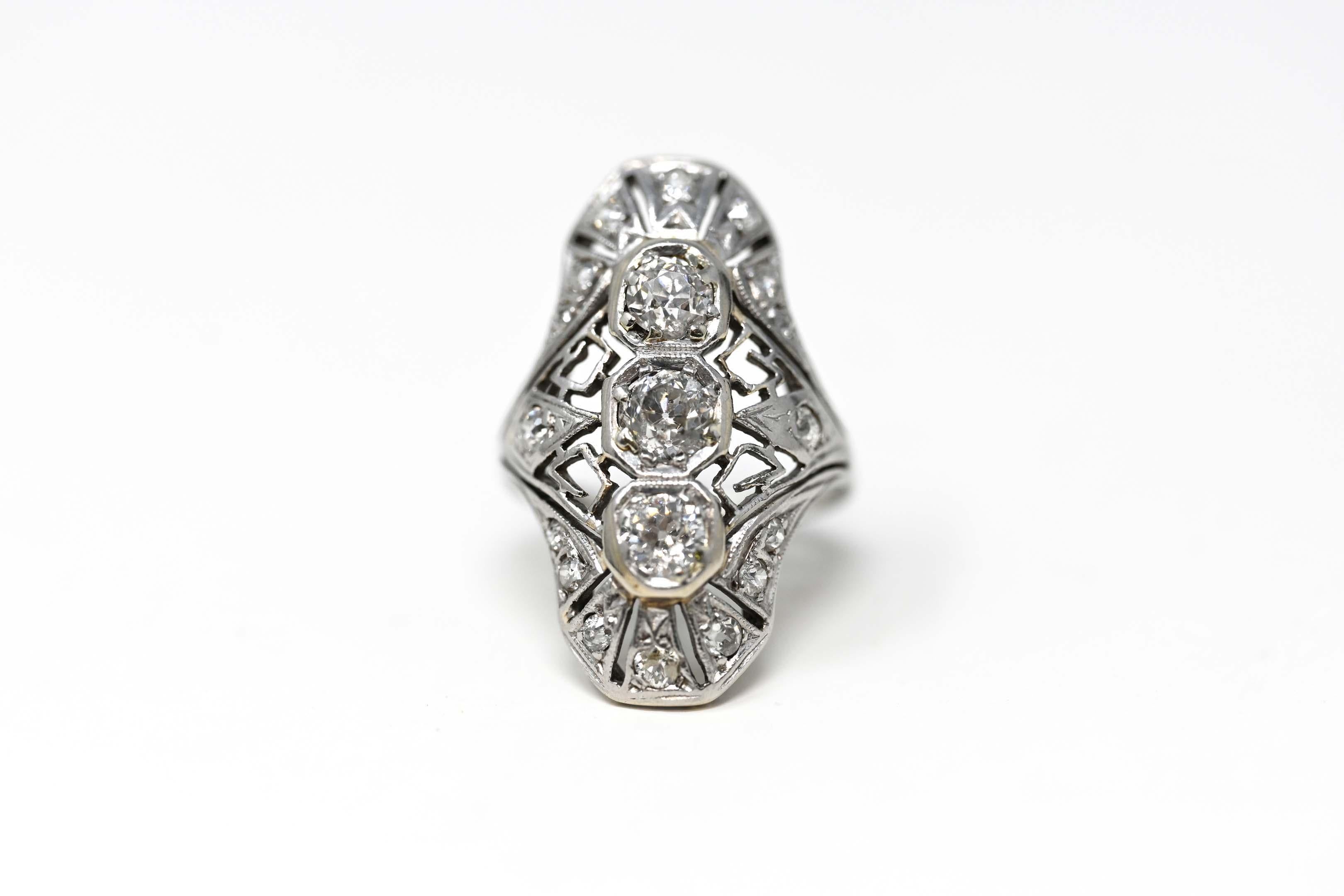 Victorian 14k with gold and diamonds ladies ring. Set with 16 old cut diamonds total weight .35 ct. The central diamond measures 5mm in diameter, weighs approximately .45 ct, clarity VS-SI, color HI. Two more diamonds approximately 4.4 mm in