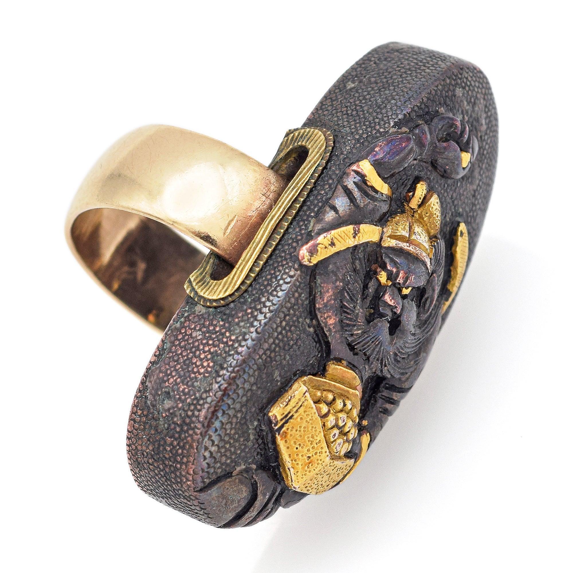 A captivating blend of East meets West, this Victorian ring features an unique oval centerpiece crafted from Japanese shakudo — a traditional mixed-metal alloy of copper and gold known for its rich, dark patina. Set in warm 14K yellow gold, the ring