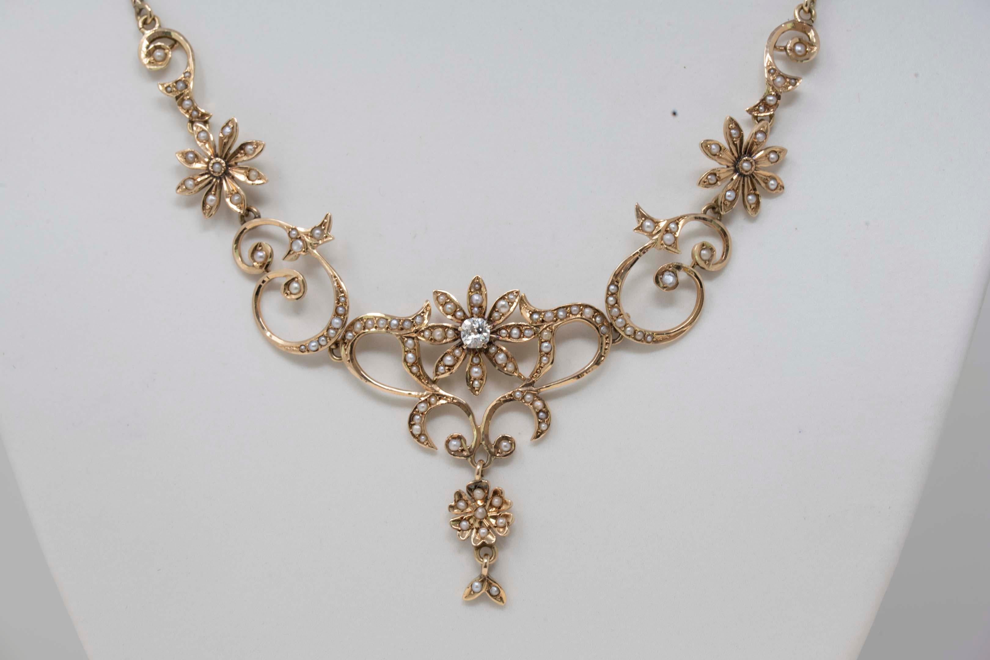 Victorian 14k yellow gold necklace with one diamond european old cut weighing .20ct and over 115 seed pearls. Stamped 14k, no maker mark. Measures 15 1/2 inches long. In good condition.
