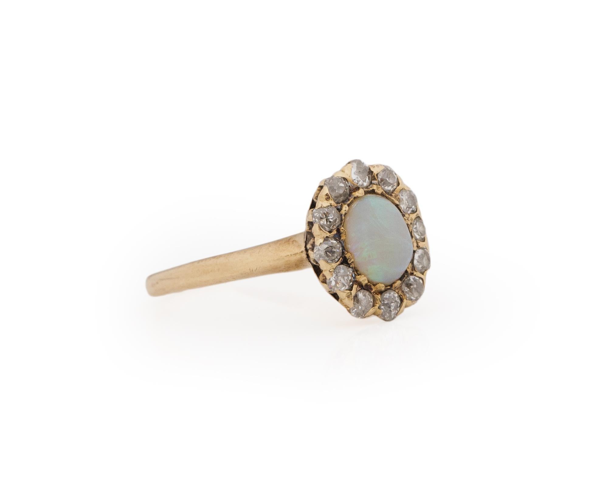 All gems deserve a halo. This ring is crafted in 14K yellow gold, in the center of the shanks is a crown looking gallery that holds an opal cabochon that has soft fire giving the piece an subtle, gentle feel. Perfect for any occasion. The Halo of