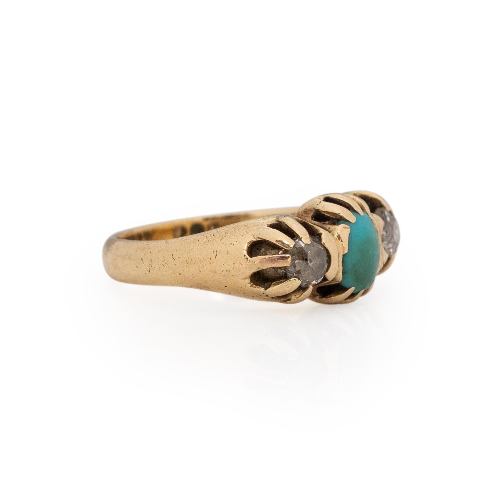 This Victorian classic has a Blecher style feel with a three stone look. Crafted in 14K yellow gold the prong setting holds two Old Mine cut diamonds and one robins egg blue oval turquoise cab. The look is simple and elegant, the pop or turquoise