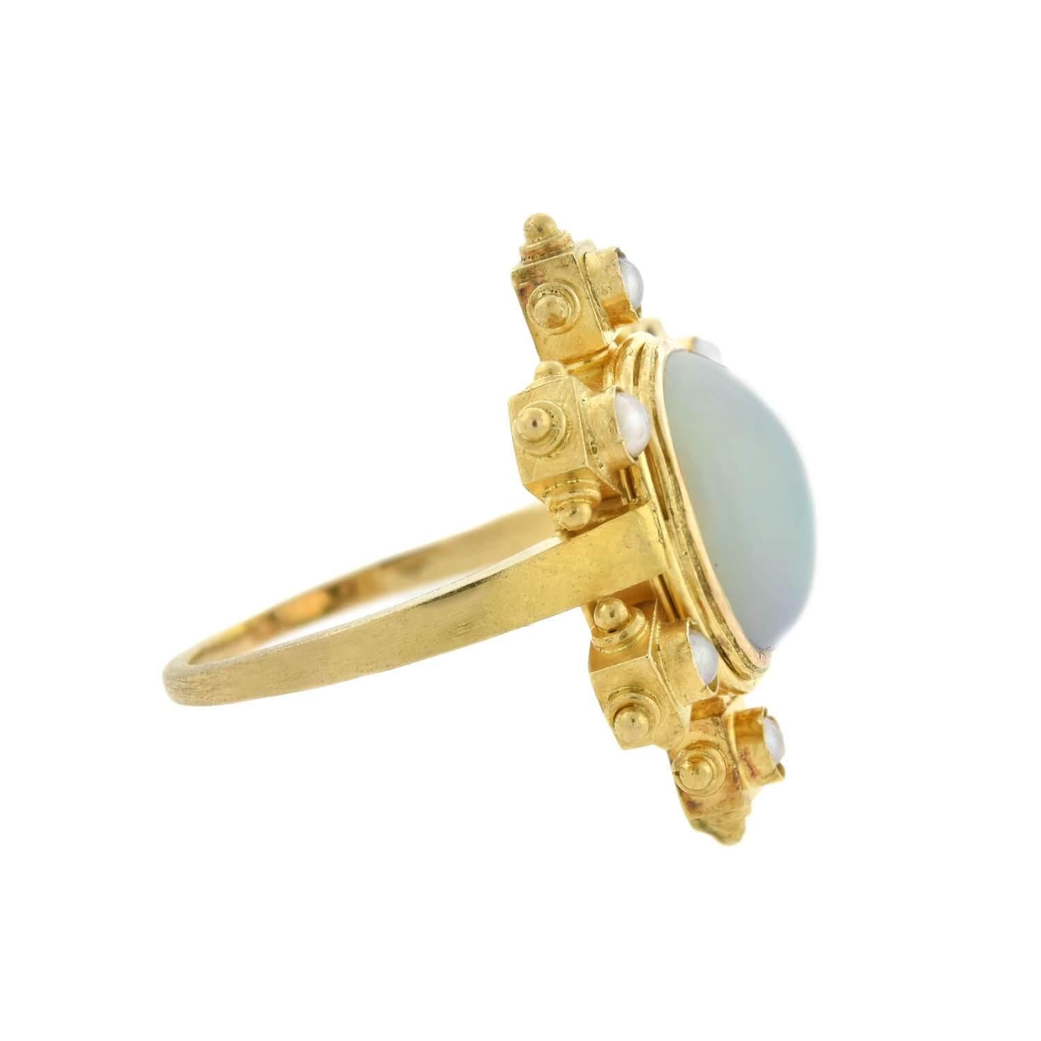 A stunning ring from the Victorian (ca1880s) era! Crafted in 14kt yellow gold, this ring displays a wonderful Architectural Revival design. Six lustrous white pearls rest in crimped bezel settings atop embellished architectural accents. An