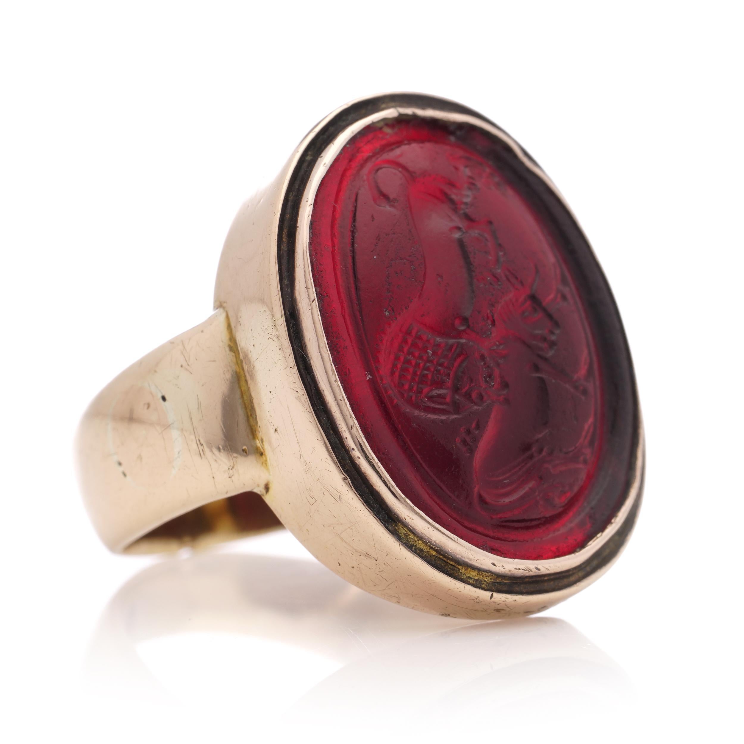 Antique 19th Century 14kt. rose gold red pique glass intaglio, featuring a lion attacking horned animal. 
X-Ray tested positive for 14kt. gold. 

Dimensions - 
Ring Size (UK) = N(EU) = 55 (US) = 7 
Ring size: 2.2 x 2 x 0.7 cm 
Weight: 9.00