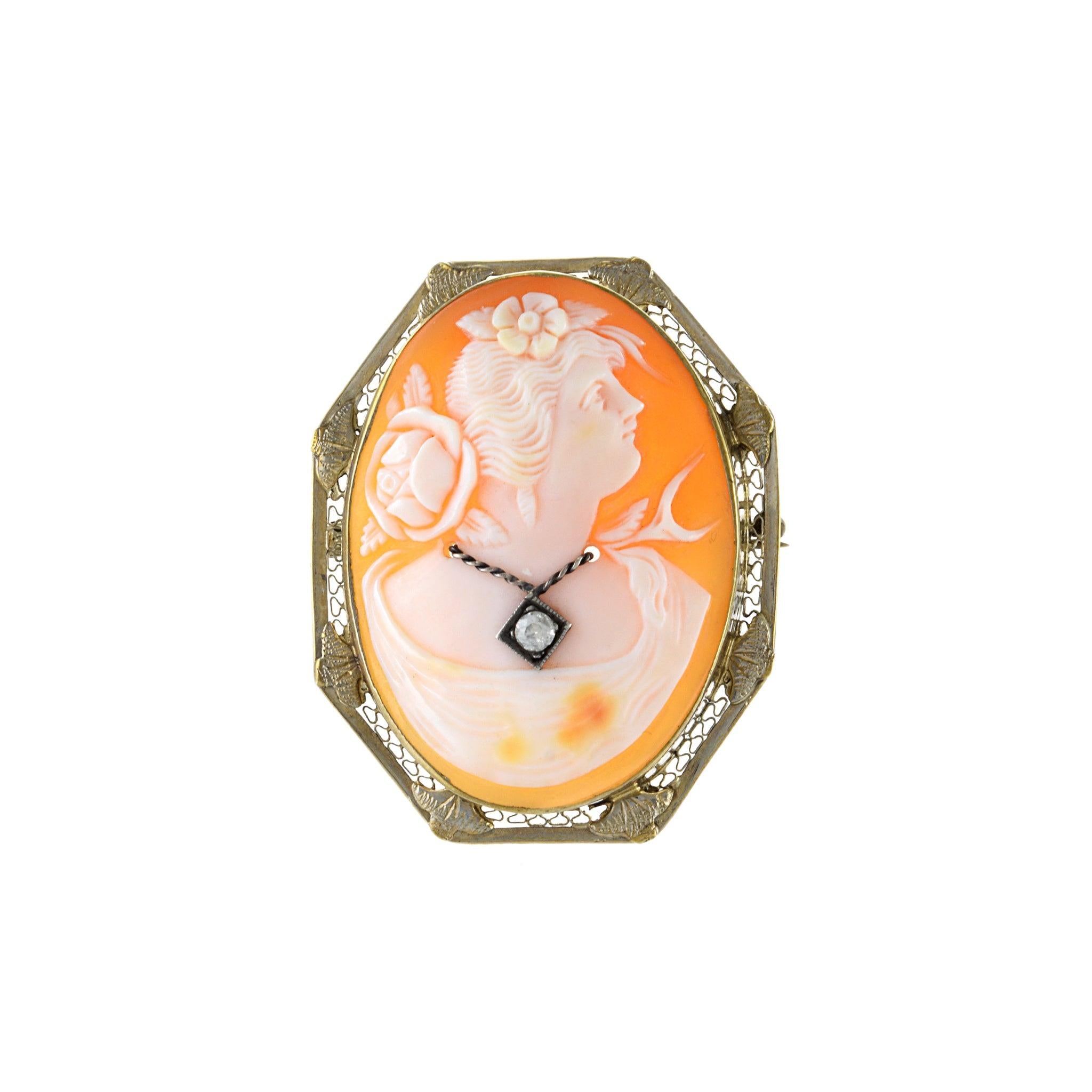 This Victorian portrait Cameo pin is an elegant and timeless addition to any jewelry collection. Crafted from 14KT yellow gold in a classic octagon shape, this piece features a sparkling diamond in the center. The quality and craftsmanship of this