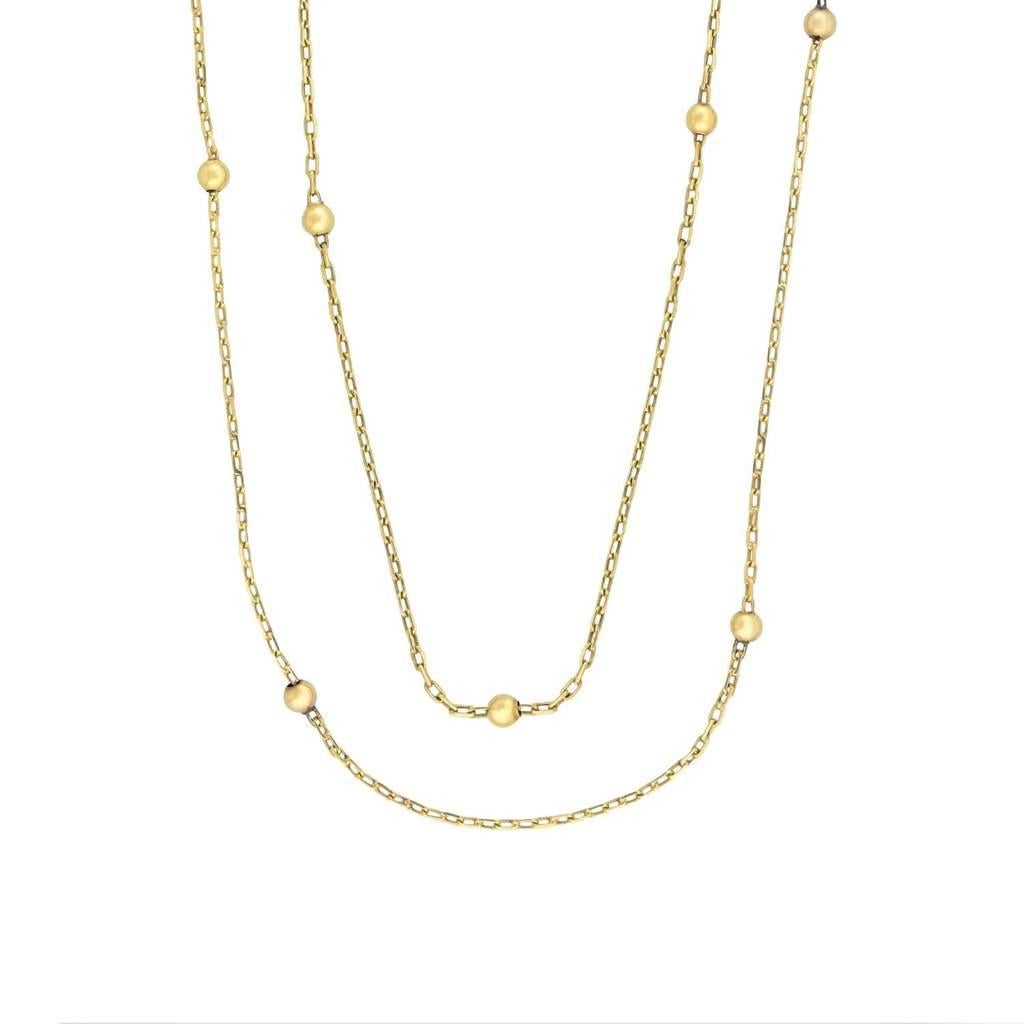 A simple yet striking chain necklace from the Victorian (ca1880s) era! Crafted in 14kt yellow gold, this necklace features golden spheres between sections of chain. The necklace is particularly long at 64