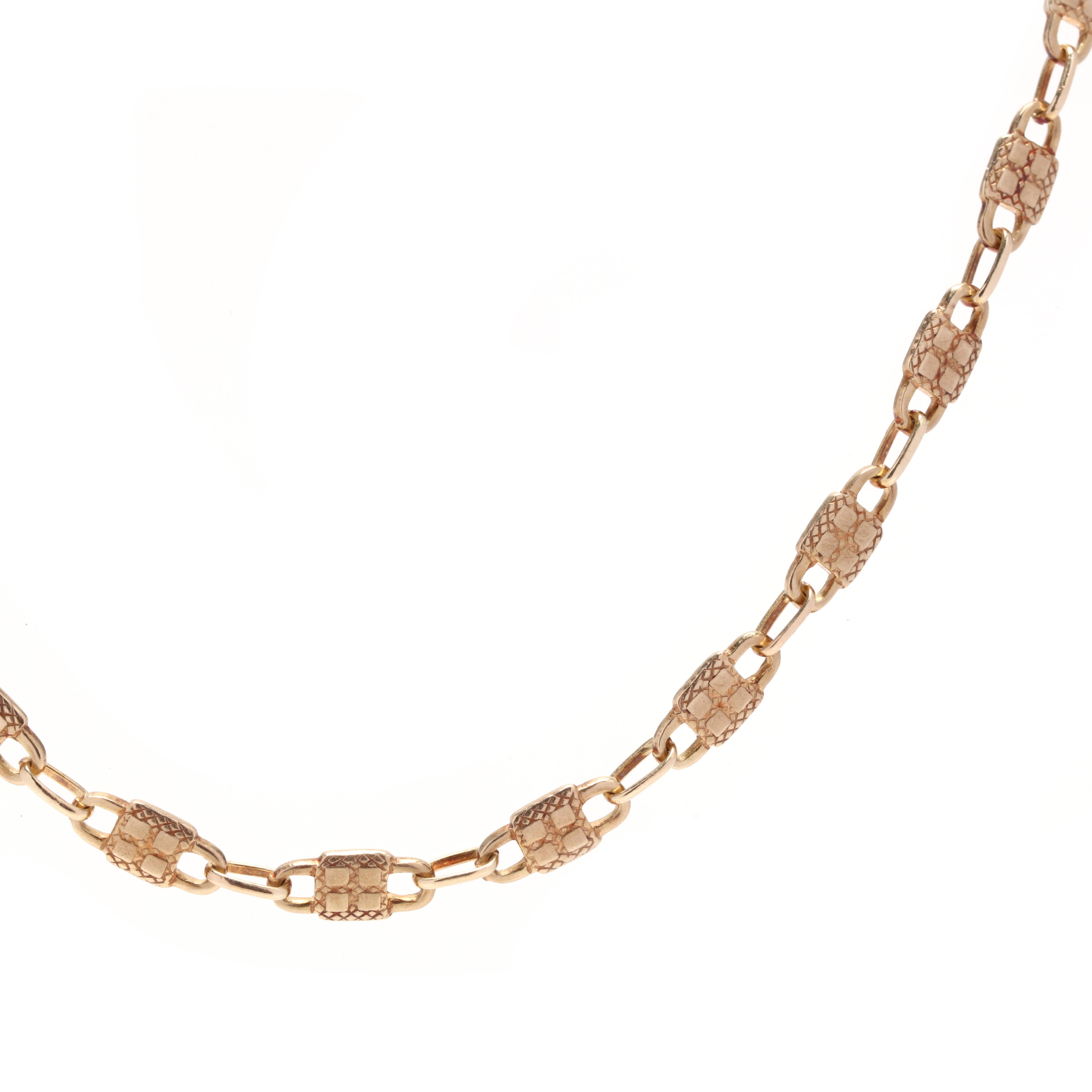 A victorian 14 karat yellow gold padlock chain necklace. This necklace features padlock motif links with raised square dot detailing and a lobster clasp.

Length: 16 in.

Width: 3.8 mm

6.5 dwts.

A Couple Of Things to Note:
* This is a vintage item