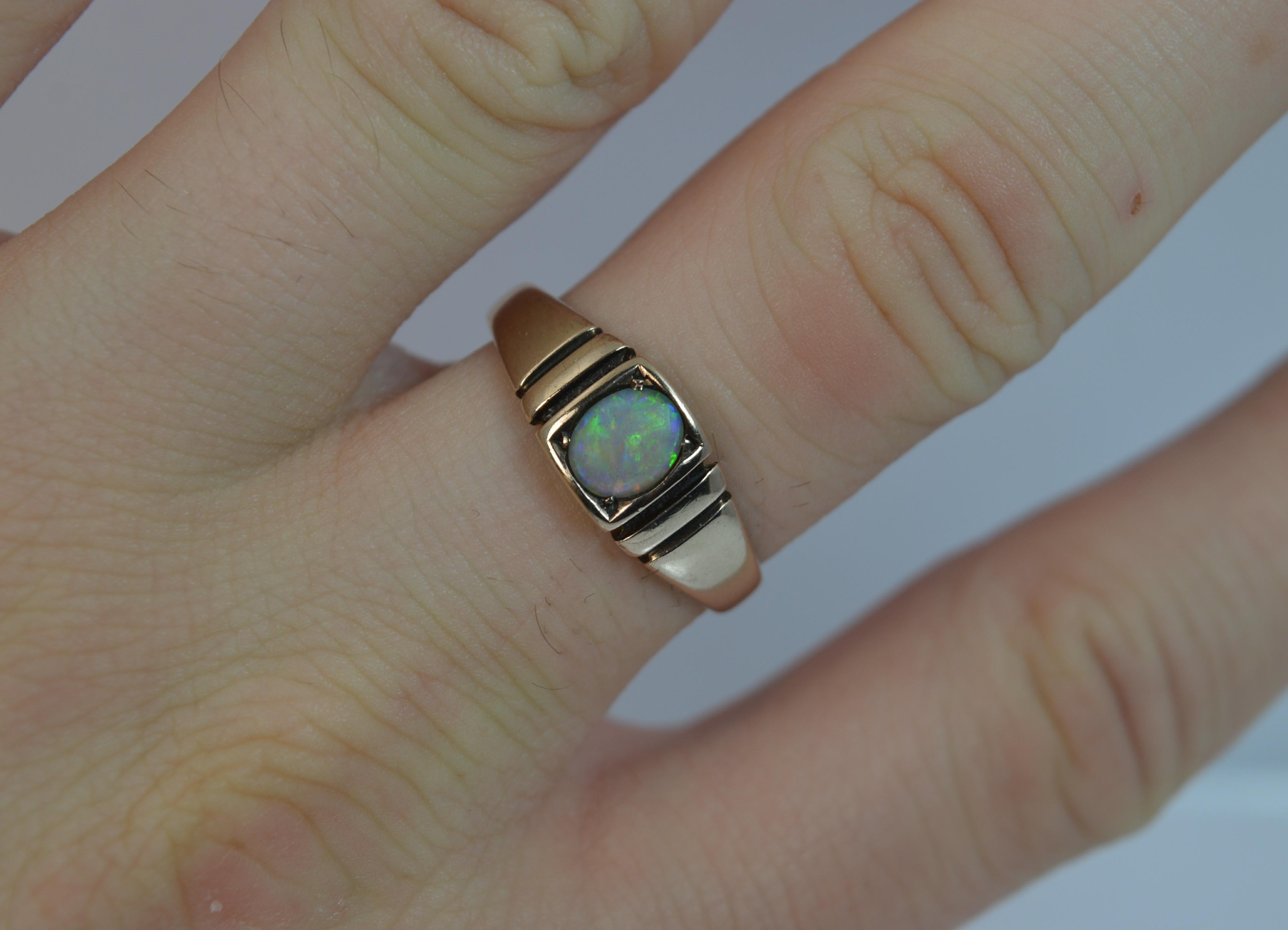 
A beautiful true antique solid 15ct gold and opal ring.

Designed with an oval shaped natural opal. 4.8mm x 5.8mm stone.

Set into a rectangular head with two deep columns to each side making the piece a simple yet stylish ring.


CONDITION ; Very