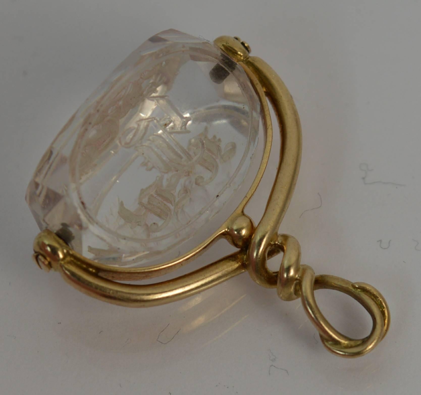 
A rare Victorian period swivel pendant.

​15 carat gold top with flowing twisted design. Designed with a three sided rock crystal with initials engraved to two sides and the third has a full profile of the Greek God Hermes.

Hermes was the Greek