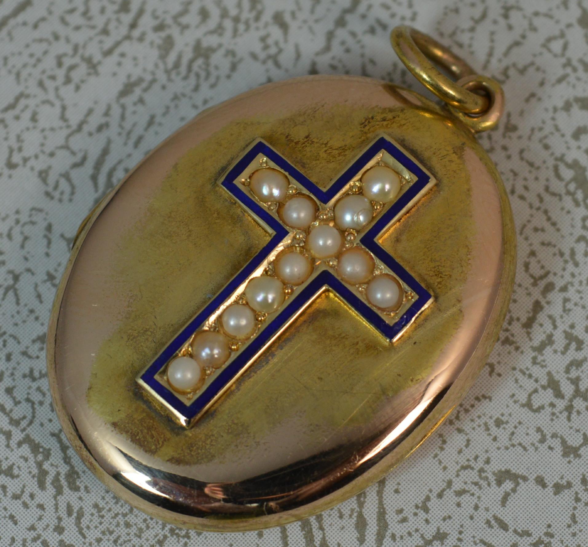 A true Victorian period pendant locket c1880.
Solid 15 carat gold throughout.
Designed to the front with a cross set with seed pearls, surrounded by blue enamelling. The surround and reverse is all plain.

CONDITION ; Good for age. Crisp design and