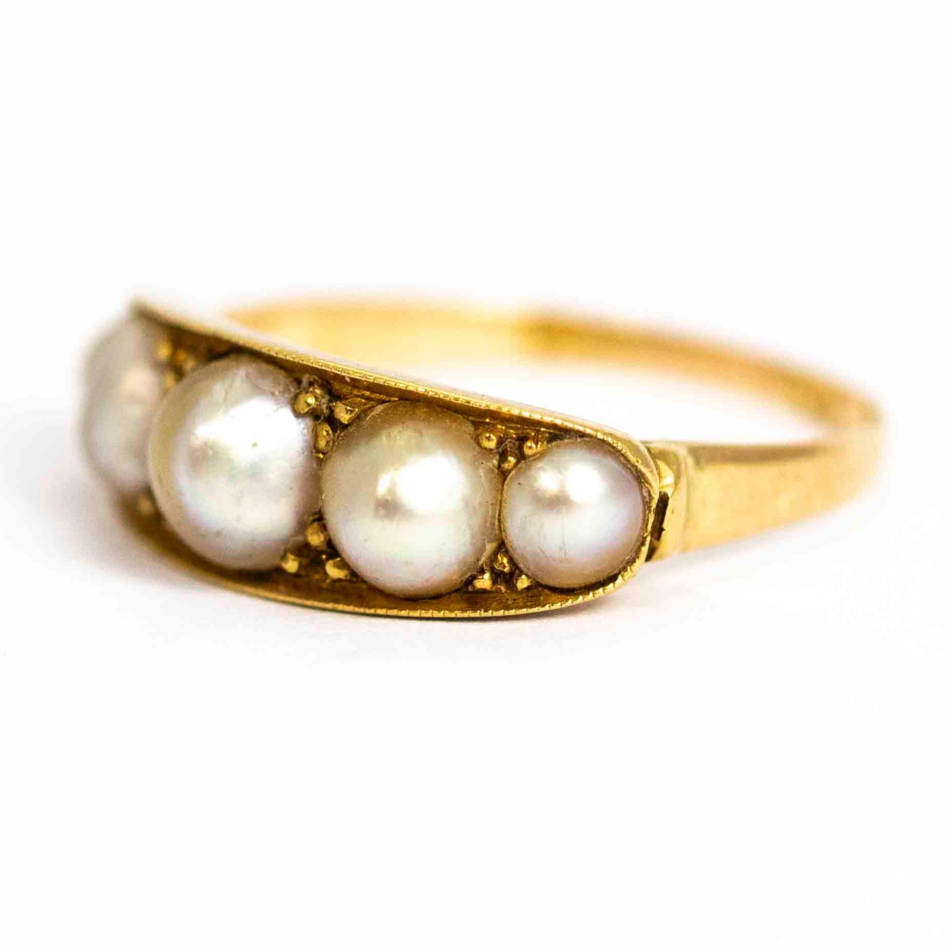 A superb antique Victorian five-stone ring set with stunning graduated pearls. The points between the pearls are set with beautiful triple claw decoration. Modelled in 15 carat yellow gold.

Ring Size: UK K 1/2, 5 3/4
