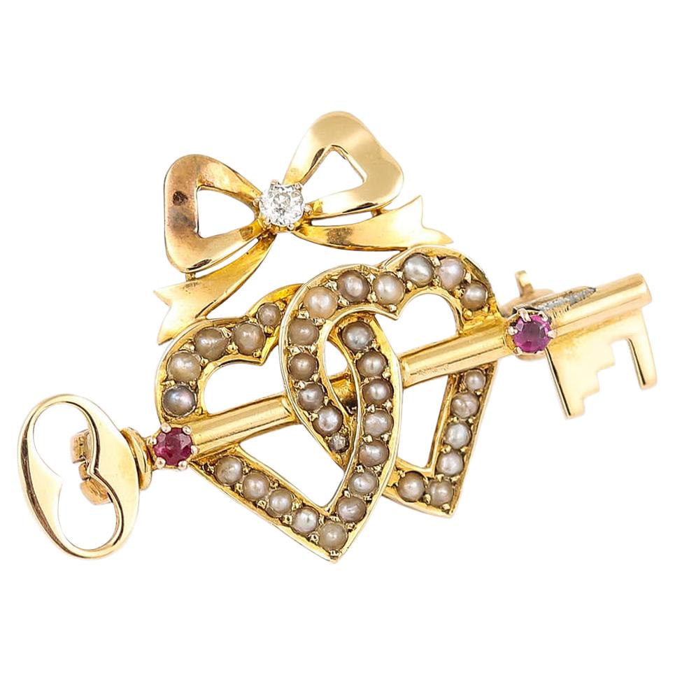 Victorian 15 Karat Gold Pearl Dual Sweet Heart, Ruby Key and Diamond Bow Brooch