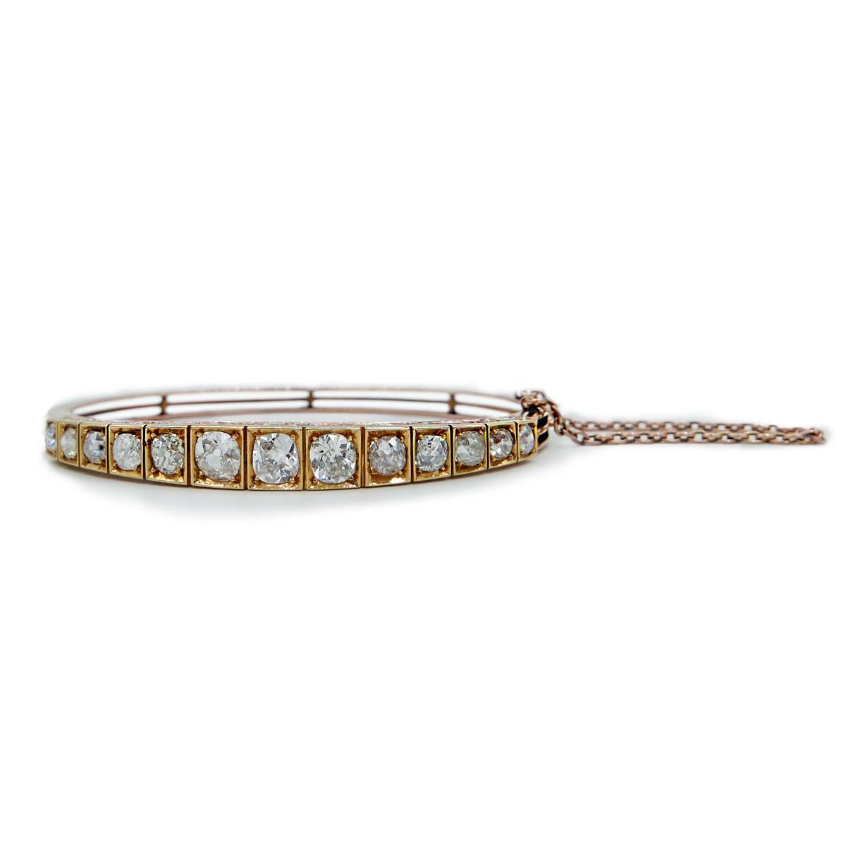 19th Century 15k Yellow Gold and 4.5cts Old European Cut Diamond Bangle, Center Diamond is .75cts. Beautifully made with stunning old diamonds filled with personality. 
Hand Engraved Gallery to the side of the bangle. Tongue and grove lock and