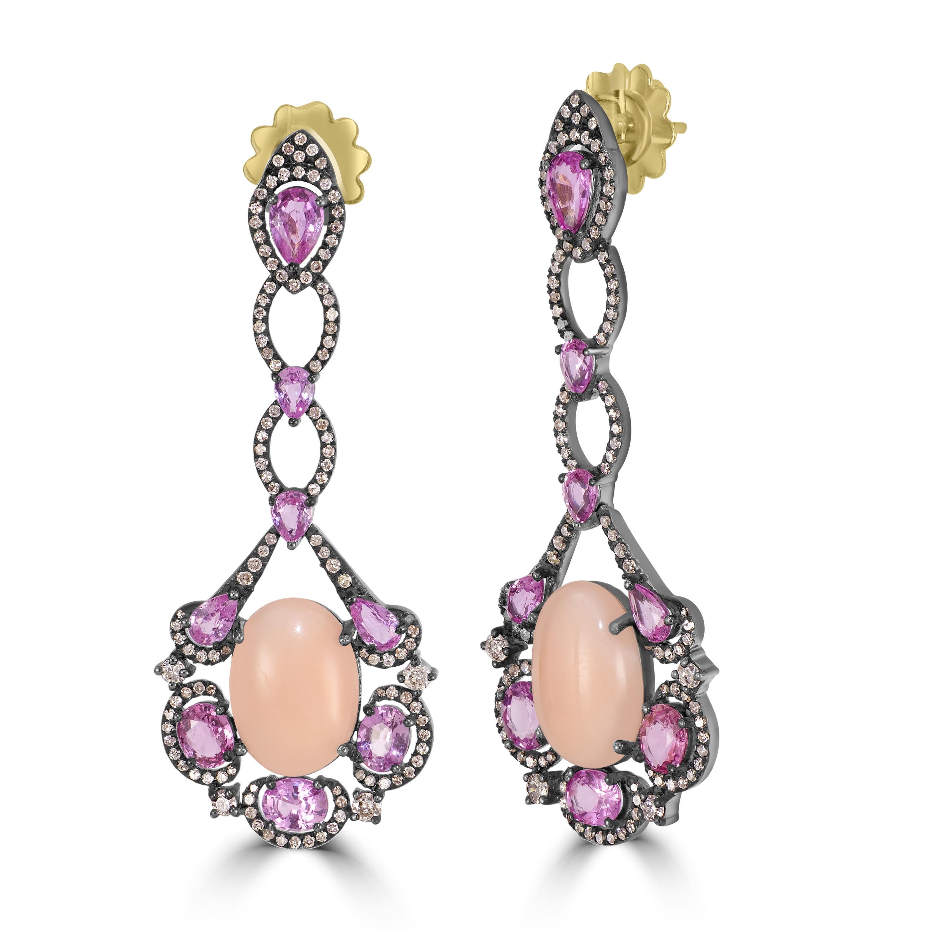 Introducing our Victorian 15.3 Cttw. Peach Coral, Pink Sapphire, and Diamond Dangle Earrings – a stunning blend of elegance and sophistication.

These exquisite dangle earrings feature a captivating design, with a luscious peach coral center