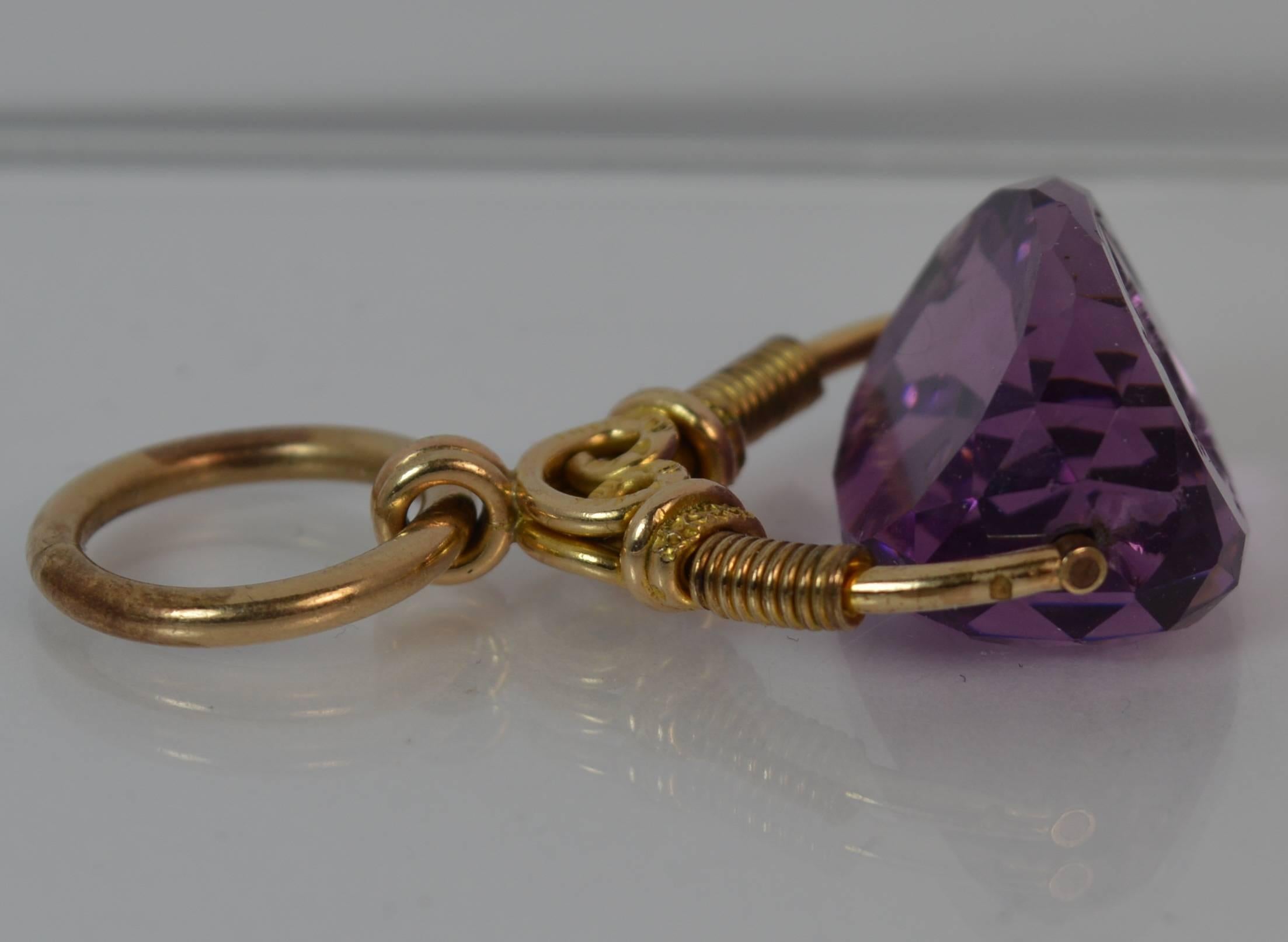 
A rare Victorian period swivel pendant.

​15 carat yellow gold example. Designed with a three sided amethyst with two plain sides and a fine intaglio to the third. The intaglio is of a female bust.

​Beautifully made example circa 1860.


CONDITION