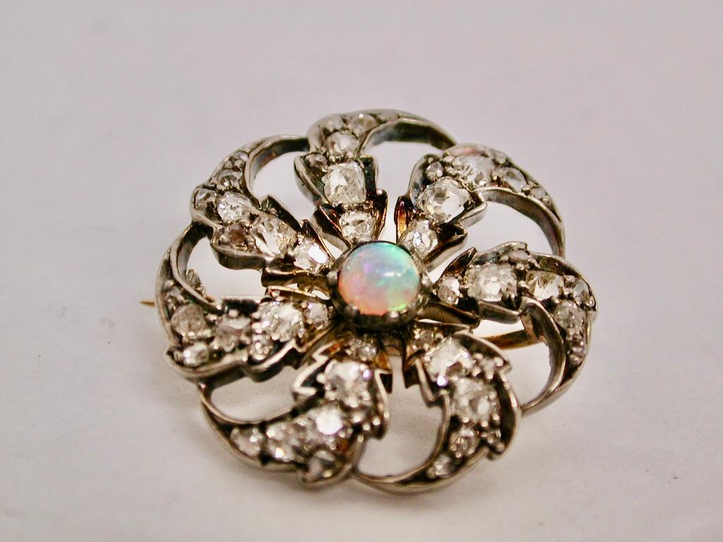 Victorian 15ct Gold Diamond Cluster Brooch With Centre Opal Dated Circa 1890
Very unusual brooch in the shape of a 