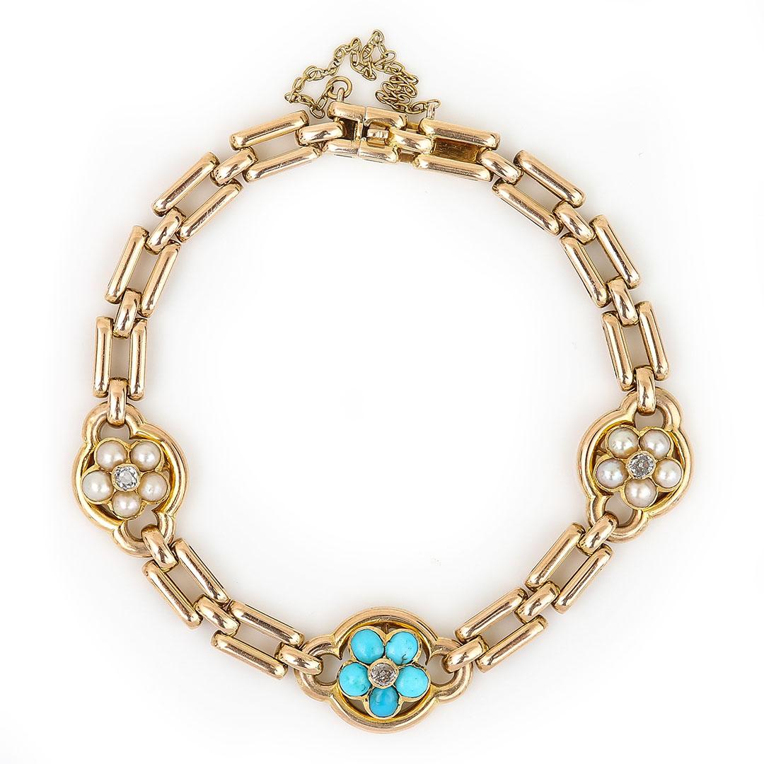 A fabulous Victorian 15ct yellow gold interlocking link bracelet set with turquoise, pearl and old cut diamond forget me not flower head motifs. The sweet and delicate bracelet is so archetypal of the period in its construction and use of quality