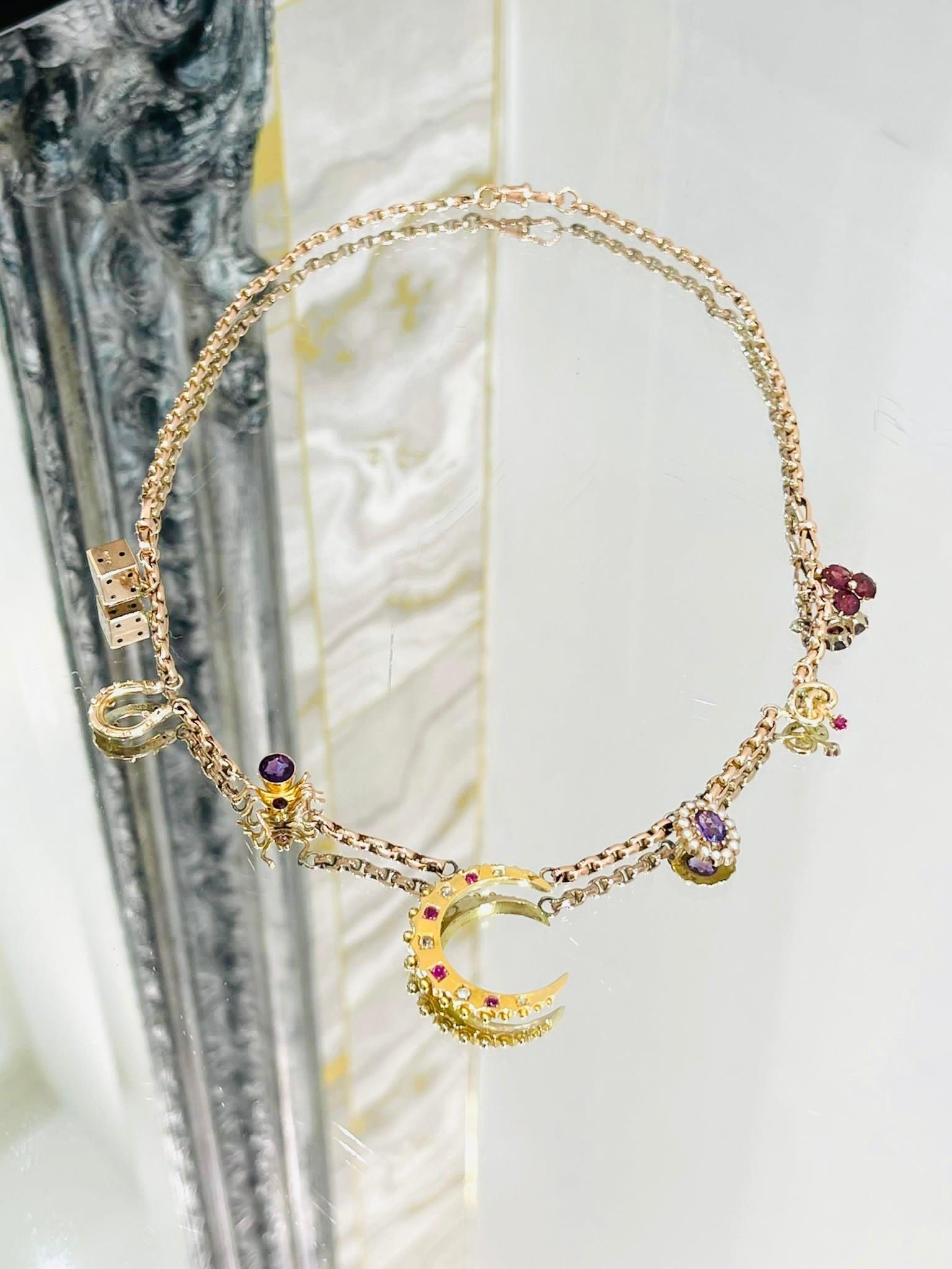Victorian 15ct Rose Gold, Diamond, Ruby, Amethyst Charm Necklace

Victorian longguard in a mix of 15ct and 9ct gold, pocket watch chain with original clasp, converted into a charm necklace. Charms consisting of:

- Crescent set with diamonds and