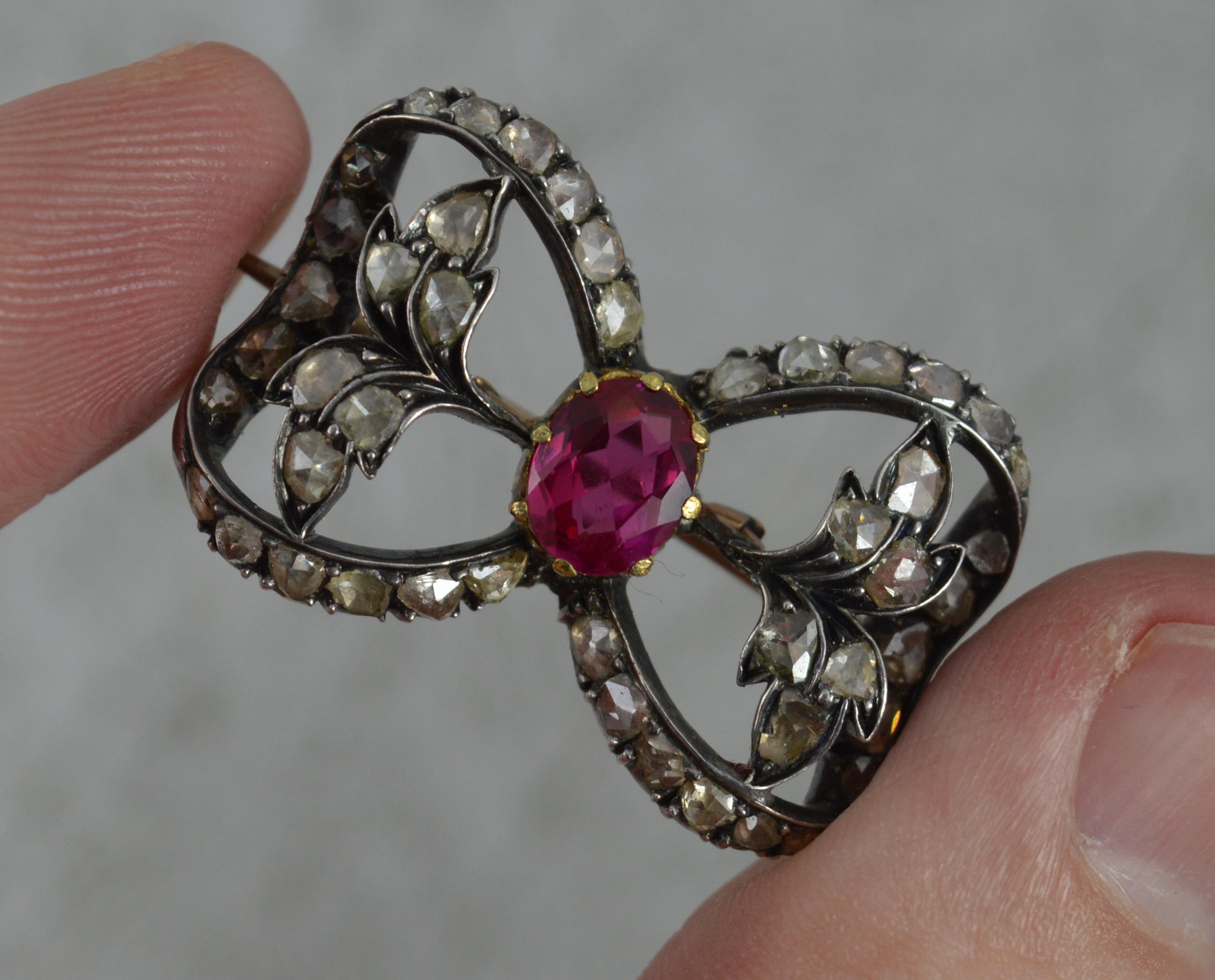 Oval Cut Victorian 15 Carat Rose Gold Ruby and Rose Cut Diamond Brooch
