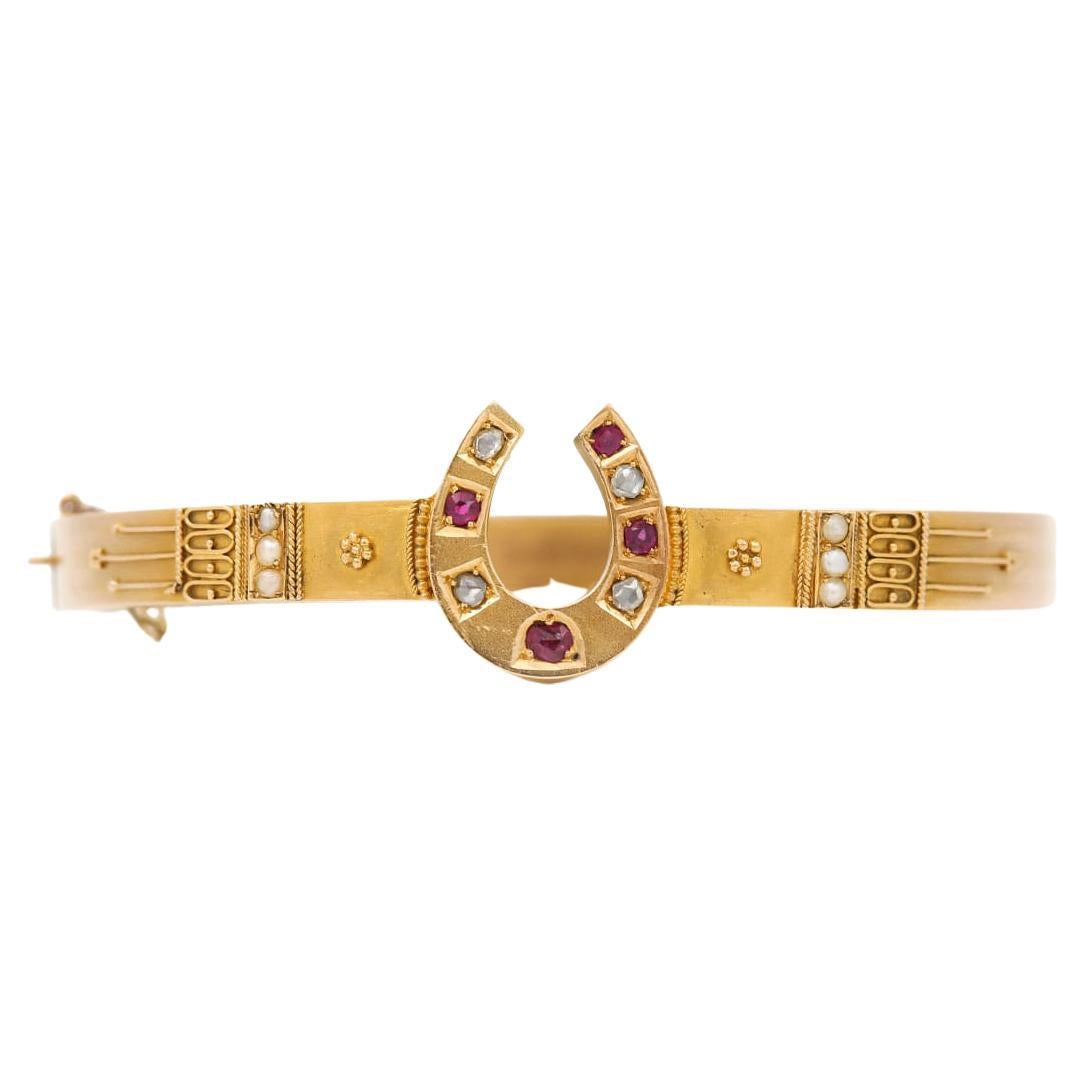 A fantastic Victorian 15ct yellow gold ruby, diamond, and pearl Etruscan style bracelet. Dating from the period 1860-1870 when the gold granulation process was developed by jewellers, inspired by Castellani and other notable goldsmiths The central