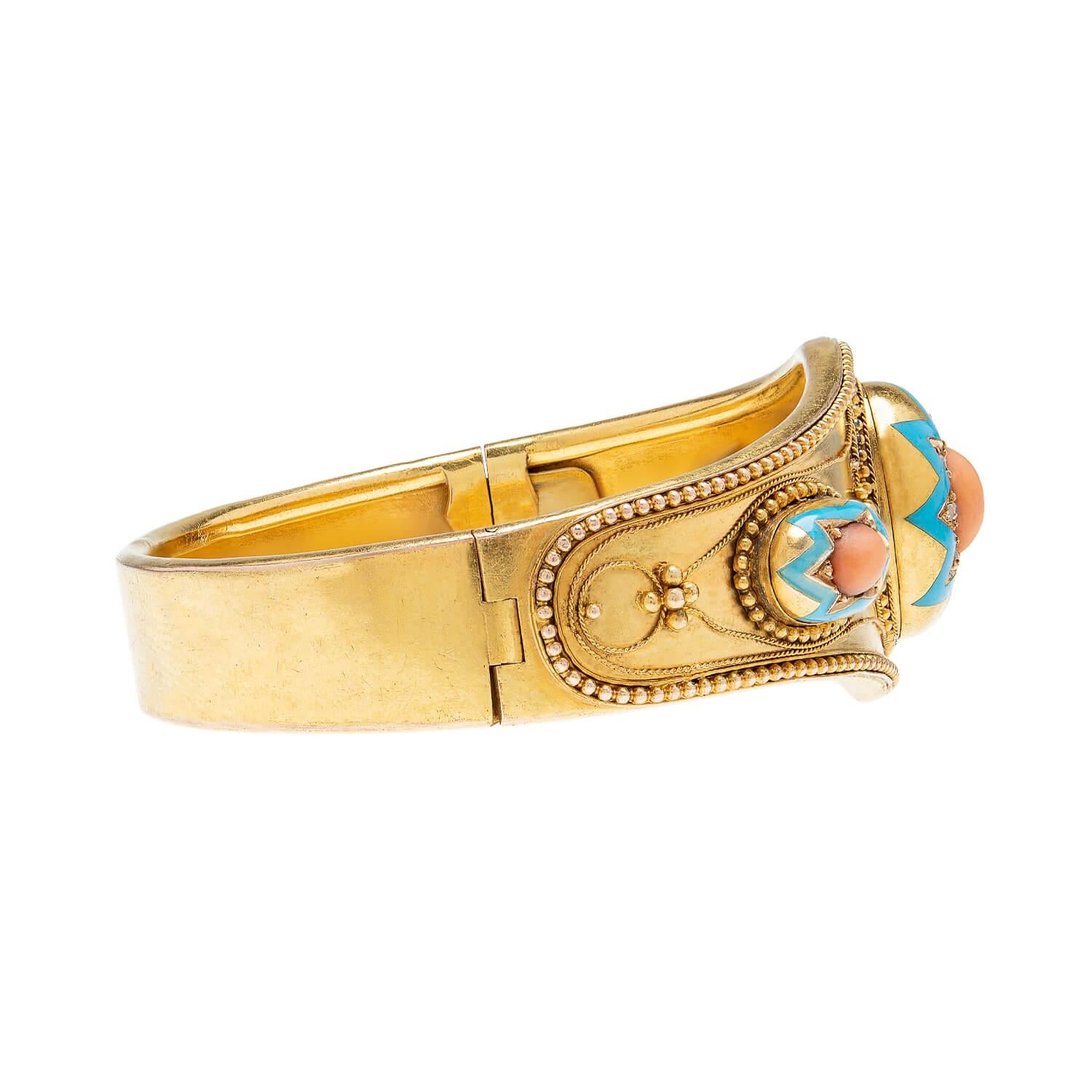 A beautiful and unusual bangle bracelet from the Victorian (ca1880) period! Crafted in 15k gold (indicating English origin), this fabulous piece has a very eye-catching design. Three raised domes decorate the front, each with a starburst motif set