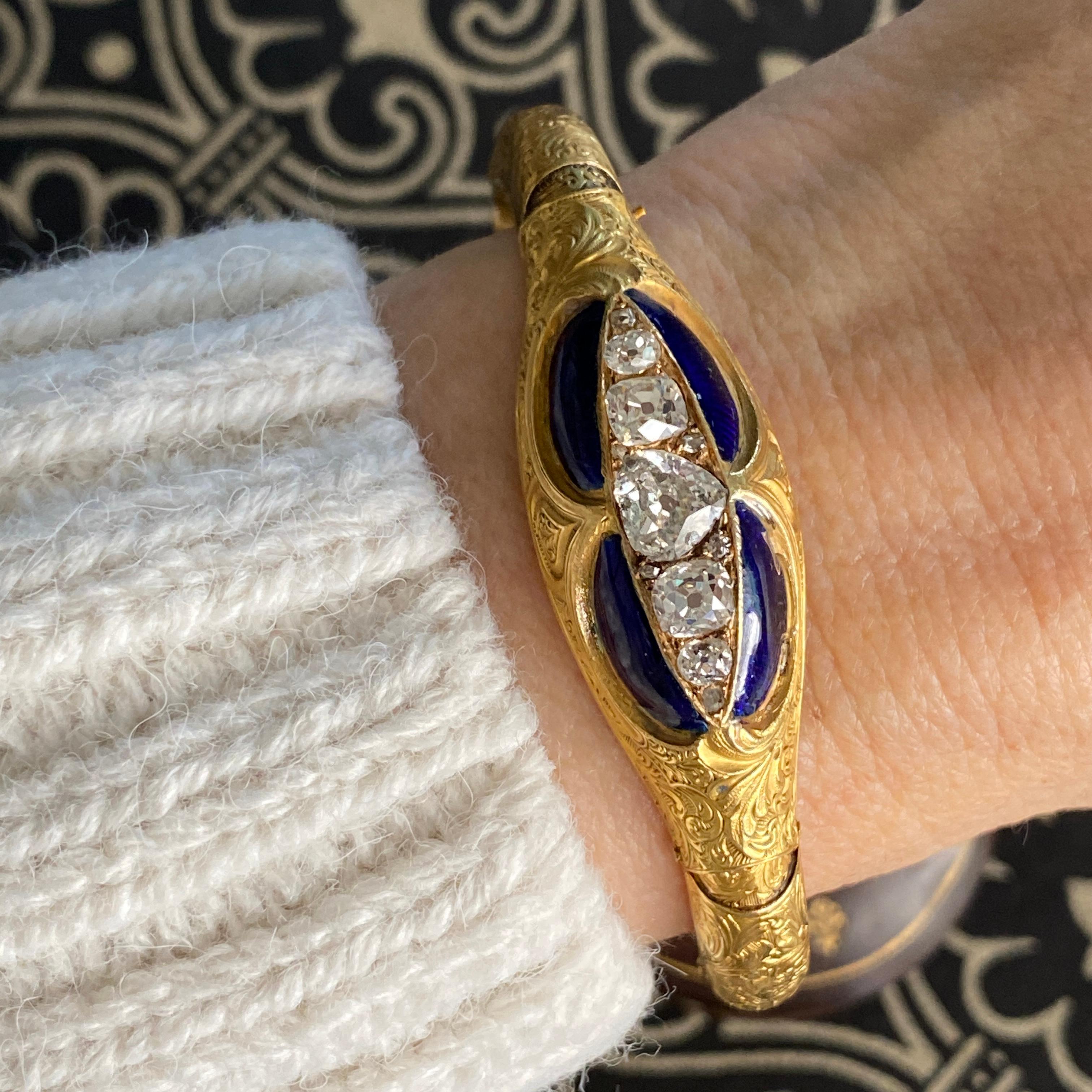 Details:
This is from our private stash. Early Victorian era bracelet in 15K gold, blue enamel with large stunning old style and mine cut diamonds. It is really quite unique, and looks as though it has been locked safely away for many years. It is