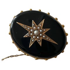 Victorian 15K Gold and Onyx Star Brooch with Seed Pearls