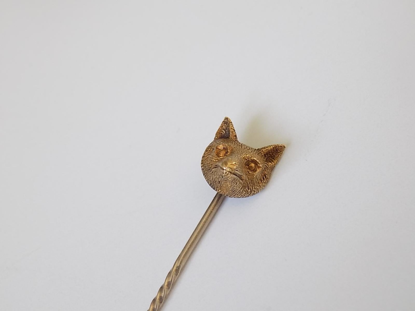 A Cute Victorian c.1890 15 Carat Yellow Gold Fox Head Mask stick pin. English origin.
Width of the Fox head 9mm, height 9mm .
Total length of the pin  60mm.
Marked 15CT for 15 Carat Gold.
The pin in good condition for the age and ready to wear.