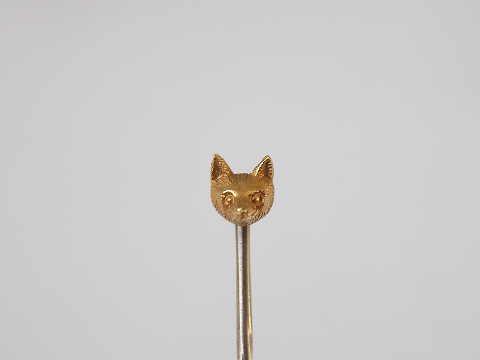 A Cute Victorian c.1890 15 Carat Yellow Gold Tiny Fox Head Mask stick pin. English origin.
Width of the Fox head 4mm, height 5mm .
Total length of the pin  46mm.
Marked 15CT for 15 Carat Gold.
The pin in very good condition for the age and ready to