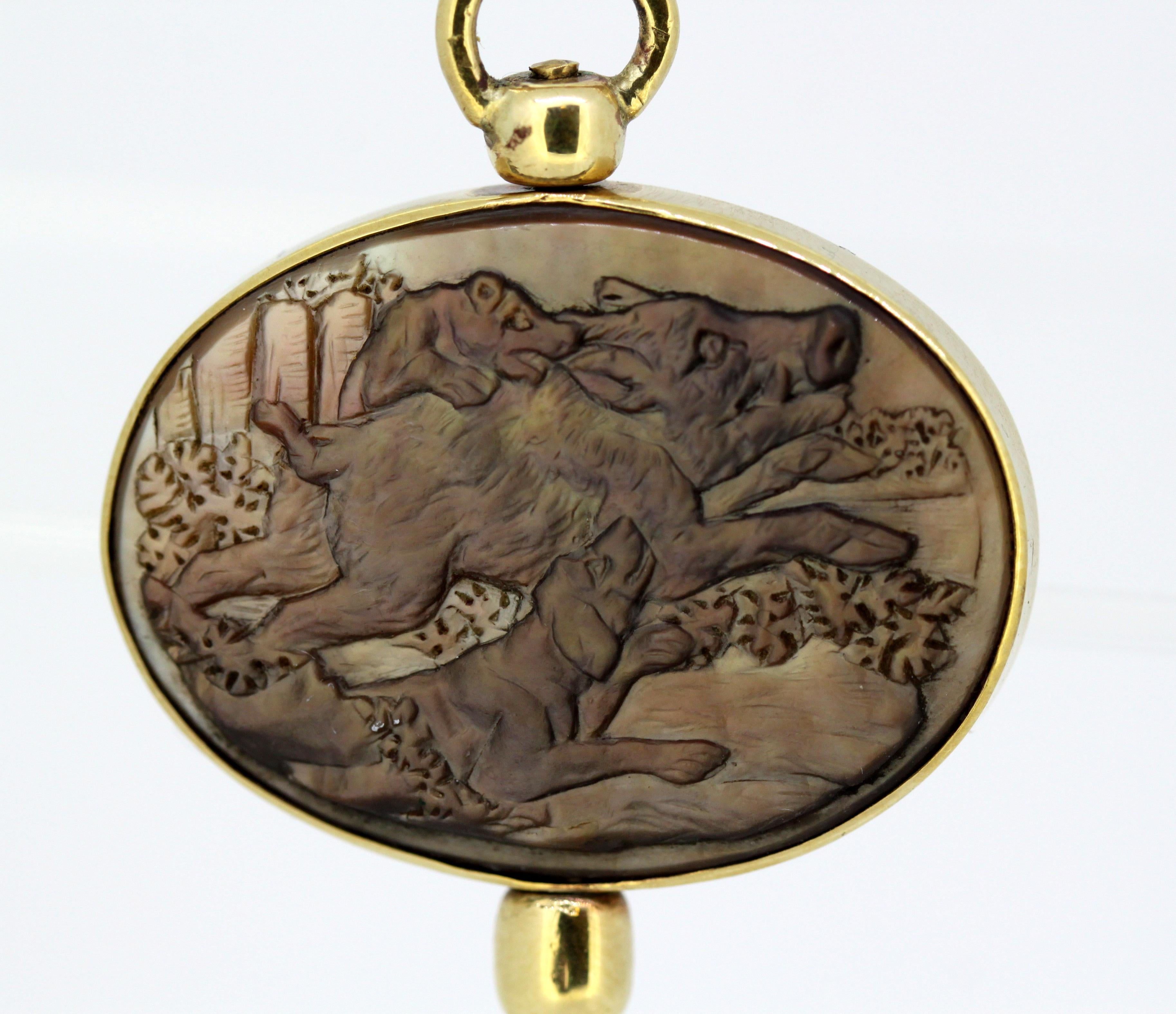 Victorian 15k yellow gold pocket watch key/pendant with mother of pearl carving of wild boars on one side, and deer and her cub on the other side.

Made in England Circa 1880's.

Dimensions -
Size : 3.3 x 3.2 x 0.5 cm
Weight: 15 grams