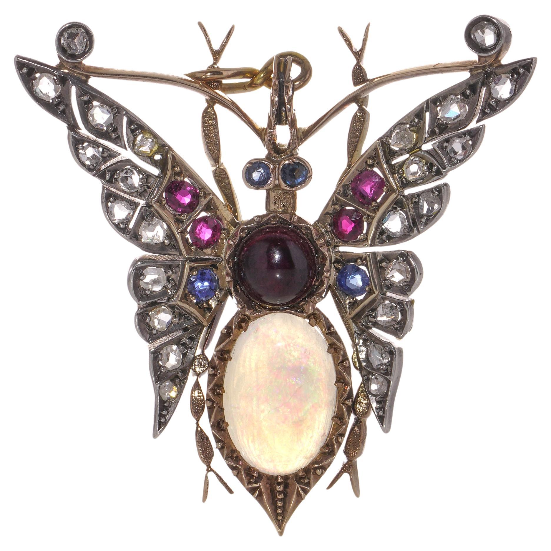 Victorian 15kt gold and silver butterfly brooch with gemstones For Sale