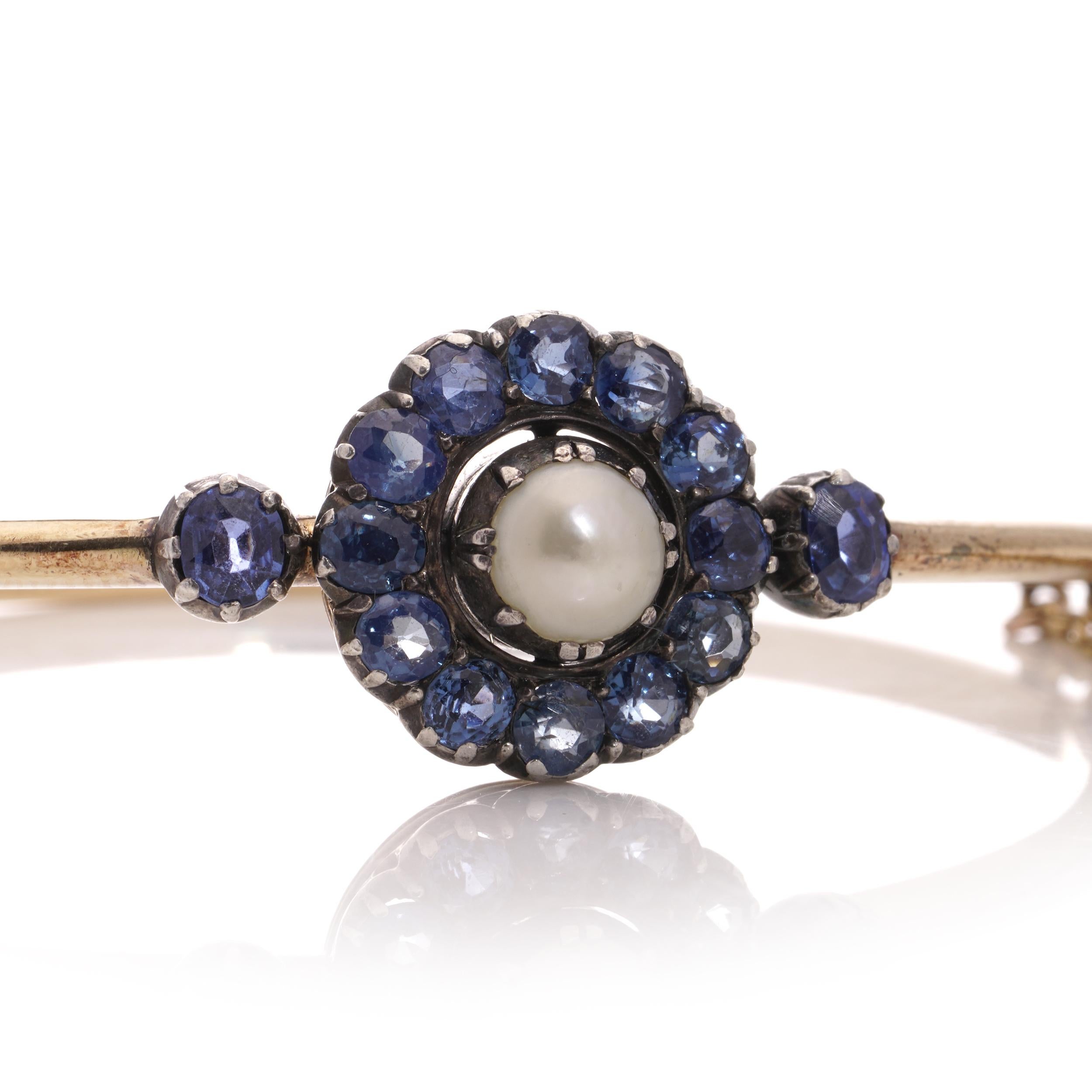 Antique Victorian 15kt. gold and silver Sapphire cluster bangle with natural pearl. 
Made in Europe, Circa 1880s 
X-Ray has been tested positive for 15kt gold and silver. 
Clasp hallmarked with maker's mark (unidentified ). 

Dimensions