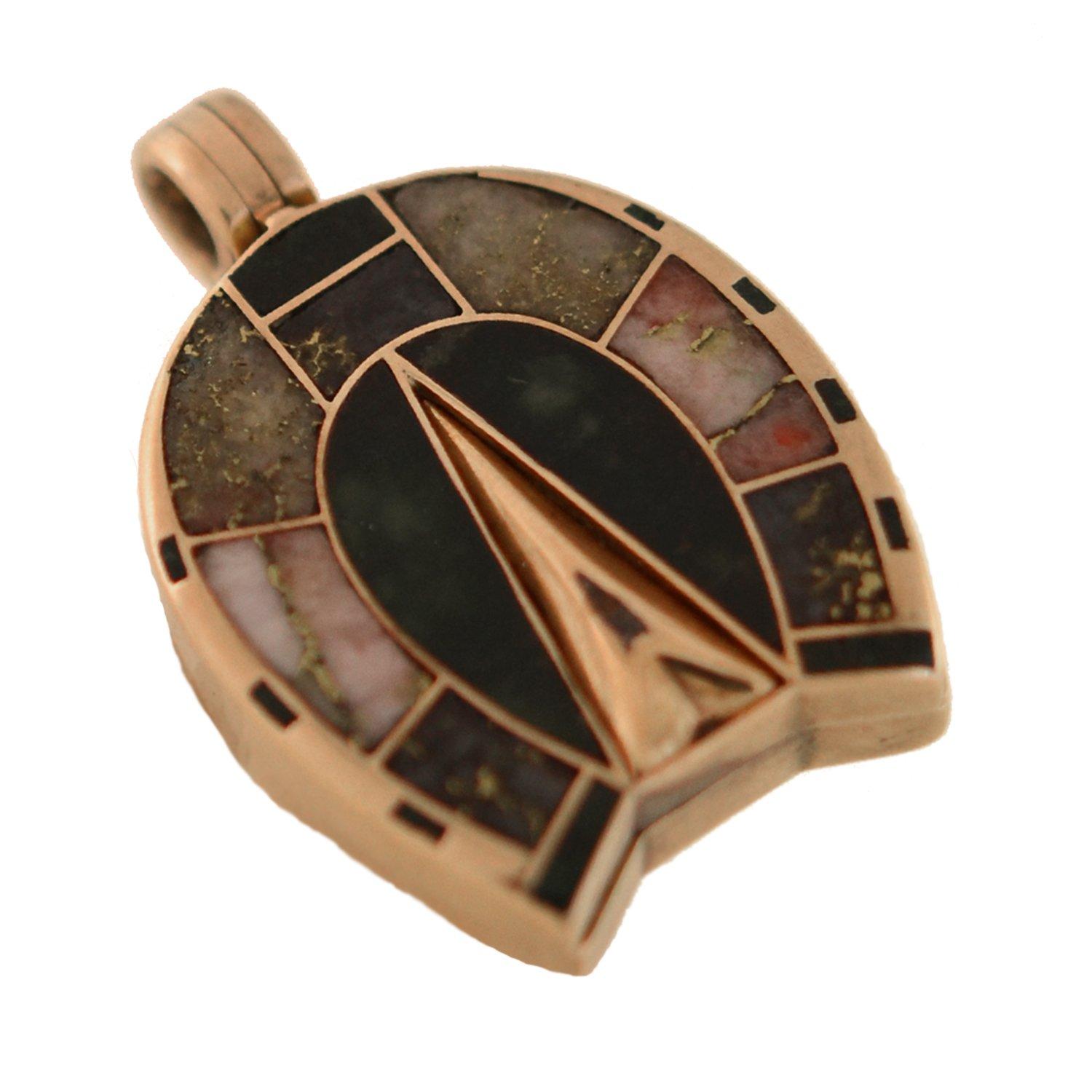 An unusual and gorgeous horseshoe locket pendant from the Victorian (ca1880) era! Crafted in 15kt rosy gold, the surface is adorned with incredible pieces of inlaid gold quartz and agate stones. Included in the ensemble of stones are varying shades
