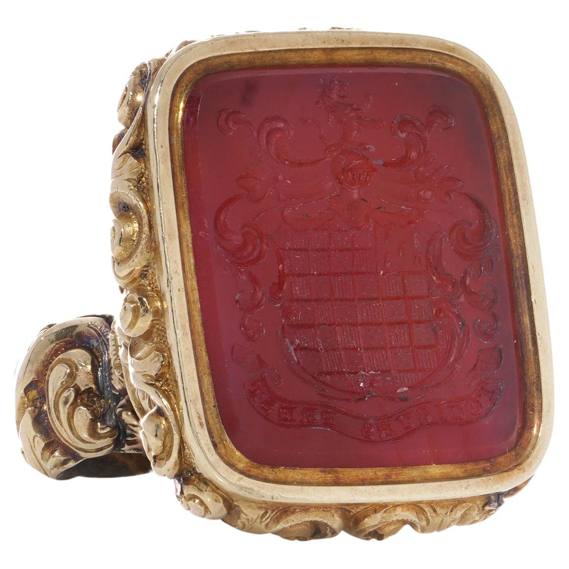 Victorian 15kt. gold seal fob with carnelian intaglio and family motto For Sale