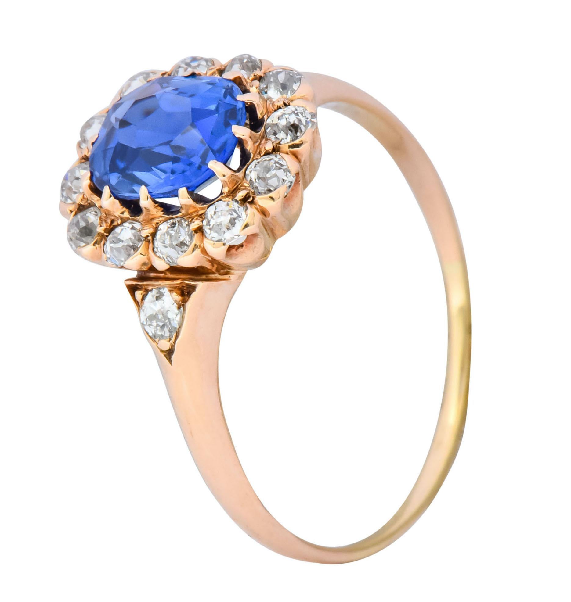 Centering an oval cut Kashmir sapphire weighing 1.10 carat, bright blue with no evidence of heat treatment 

With an old European cut diamond surround and accents, total diamond weight approximately 0.50 carat, G to J color and VS to SI