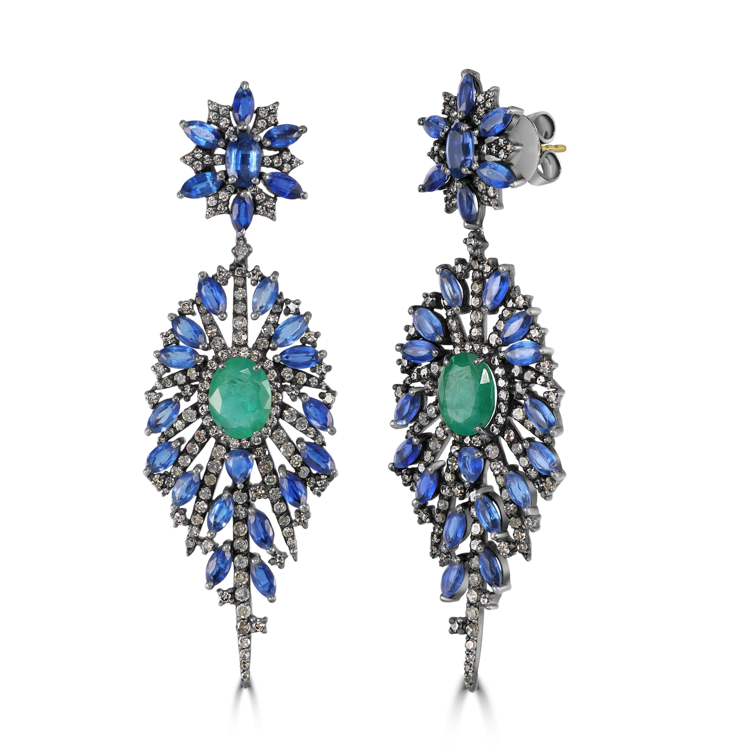 Indulge in the enchanting beauty of our Victorian Emerald, Kyanite, and Diamond Floral Dangle Earrings, a masterpiece of timeless elegance and sophistication.

These exquisite earrings feature a floral-inspired surmount adorned with alternating