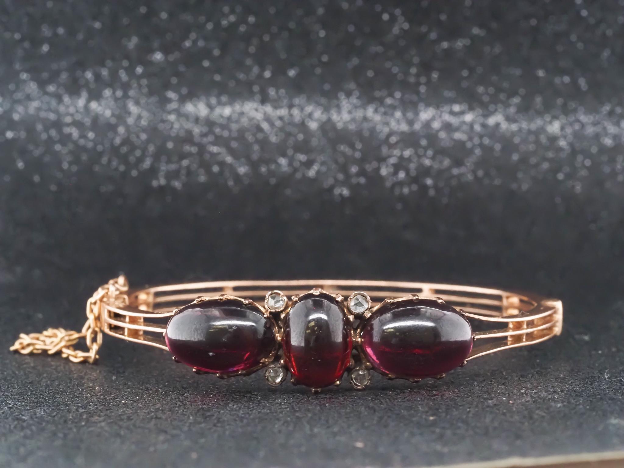 Victorian 16K Gold Garnett and Rose Cut Diamond Bangle - VHK#40c

Item Details:
Year: 1860s
Metal Type: 16K Yellow Gold [Hallmarked, and Tested]
Weight: 19.7 grams (All Items Total)

Stone Details: 13ct of Garnet, cabachon shape

Diamond: Rose Cut