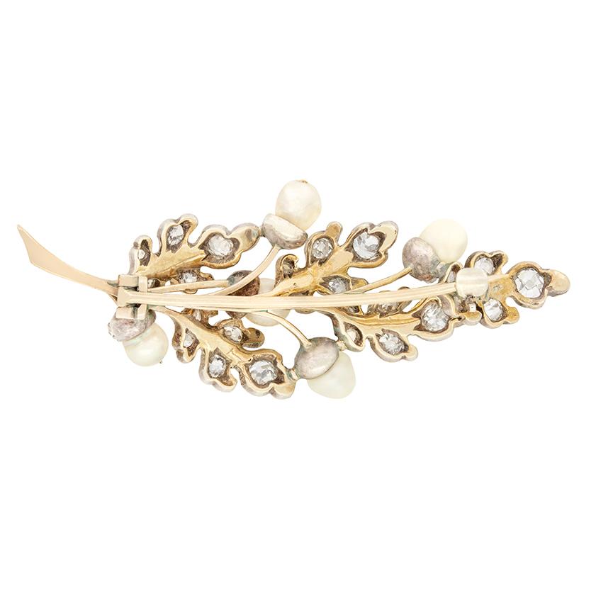 This delightfully whimsical Victorian Acorn Tree brooch is a true testament to the beauty of nature. The branch is adorned with 1.70 carats of old cut diamonds, grain set , alongside 0.50 carats of glistening rose cut diamonds nestled in between.