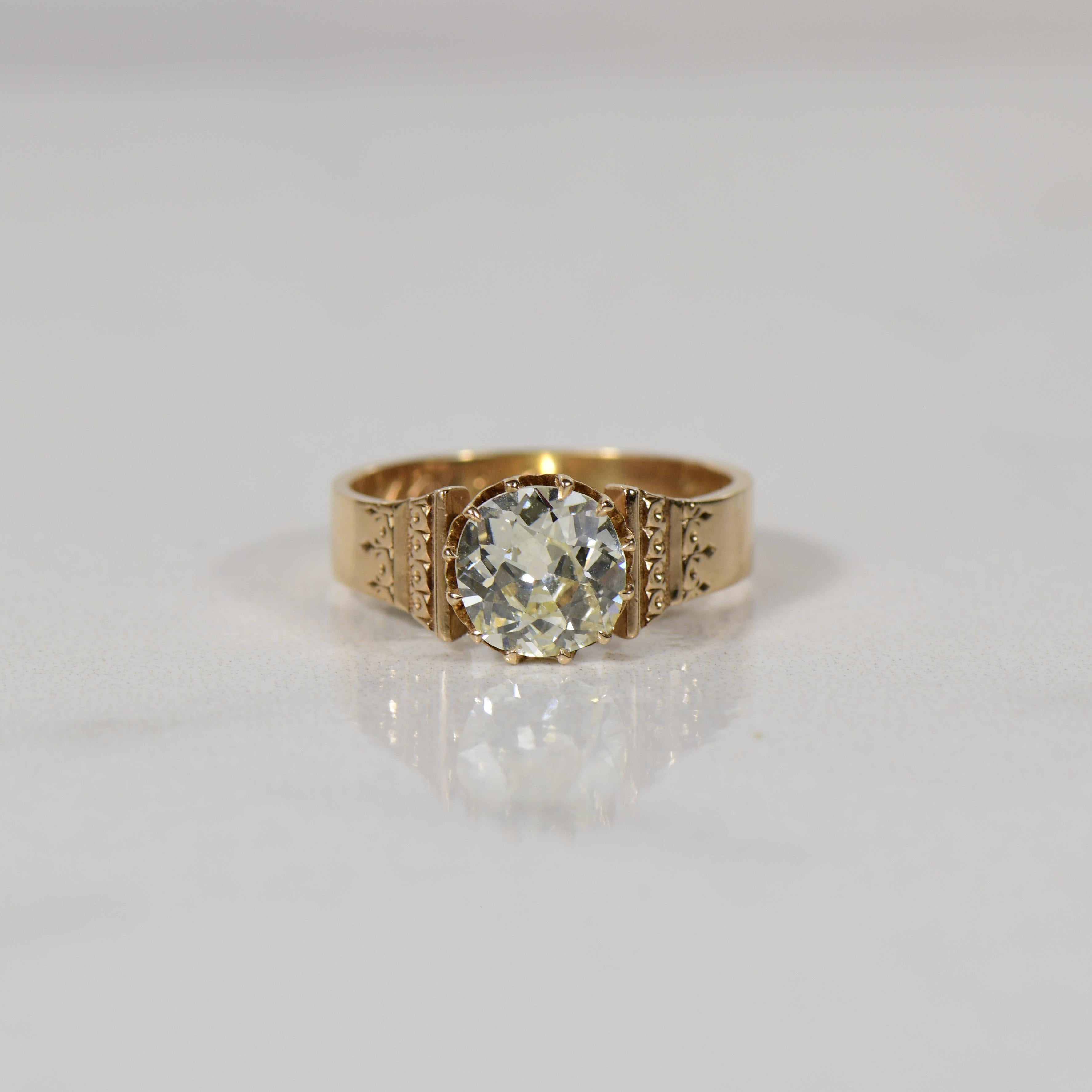 This exquisite 14K Rose Gold Victorian engagement ring boasts a dazzling 1.7-carat diamond, capturing the essence of timeless romance and sophistication. The ring is meticulously engraved with the initials 