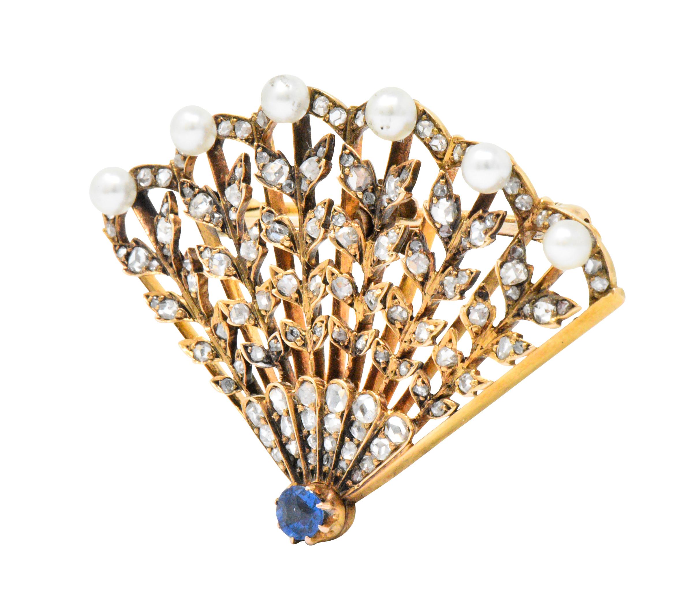 Designed as an open-work fan, set with rose cut diamonds, weighing approximately 1.50 carats total, eye-clean and white

Terminating in a round cut sapphire, weighing approximately 0.25 carats, vivid blue

Beautiful natural pearl accents, white with