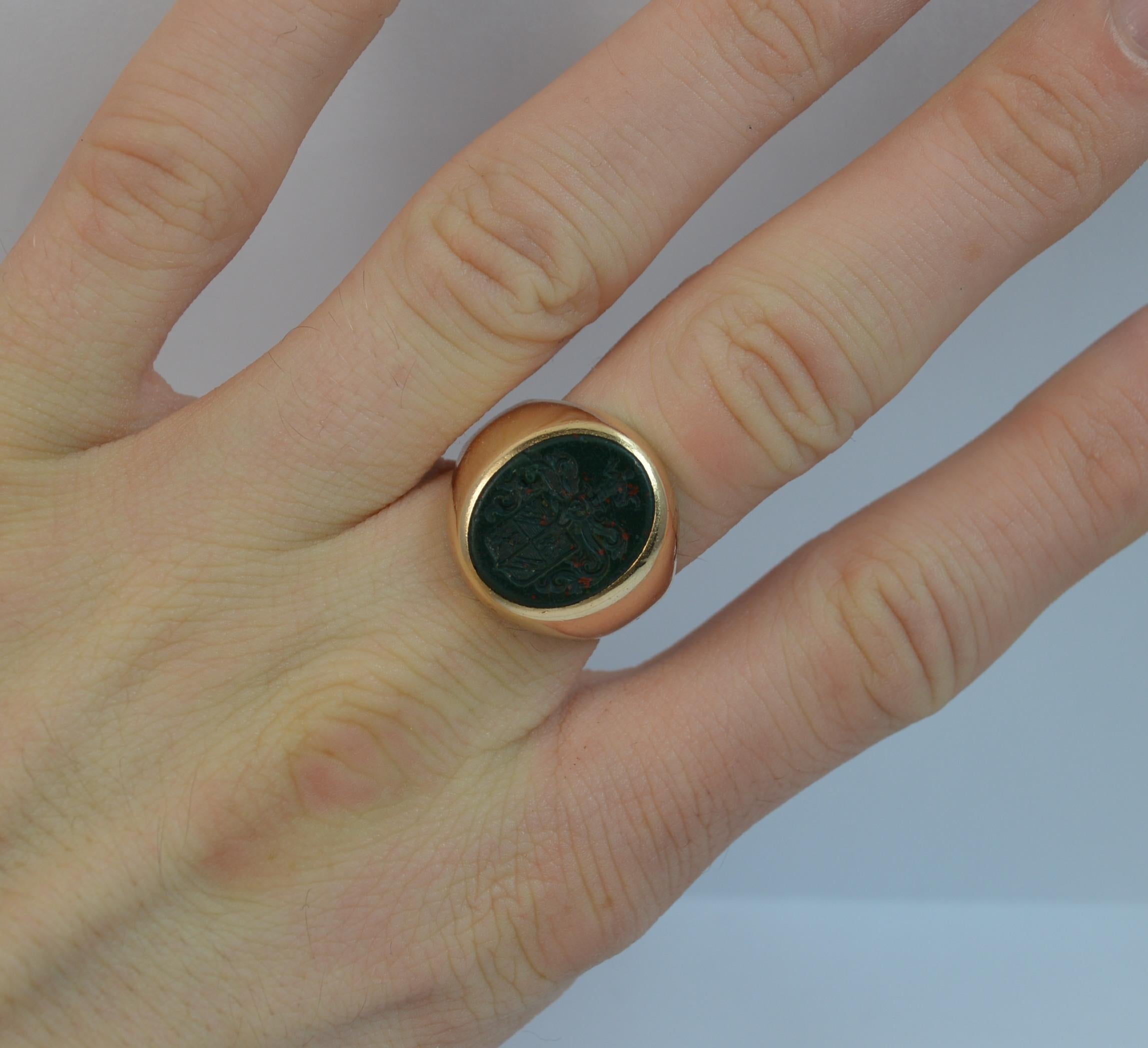 
A Victorian period intaglio seal ring.

Solid 18 carat yellow gold example.

Set with an oval cut bloodstone with a family crest intaglio seal.

12mm x 15mm stone.



CONDITION ; Very good. Solid band, clean. Well set stone, issue free, light
